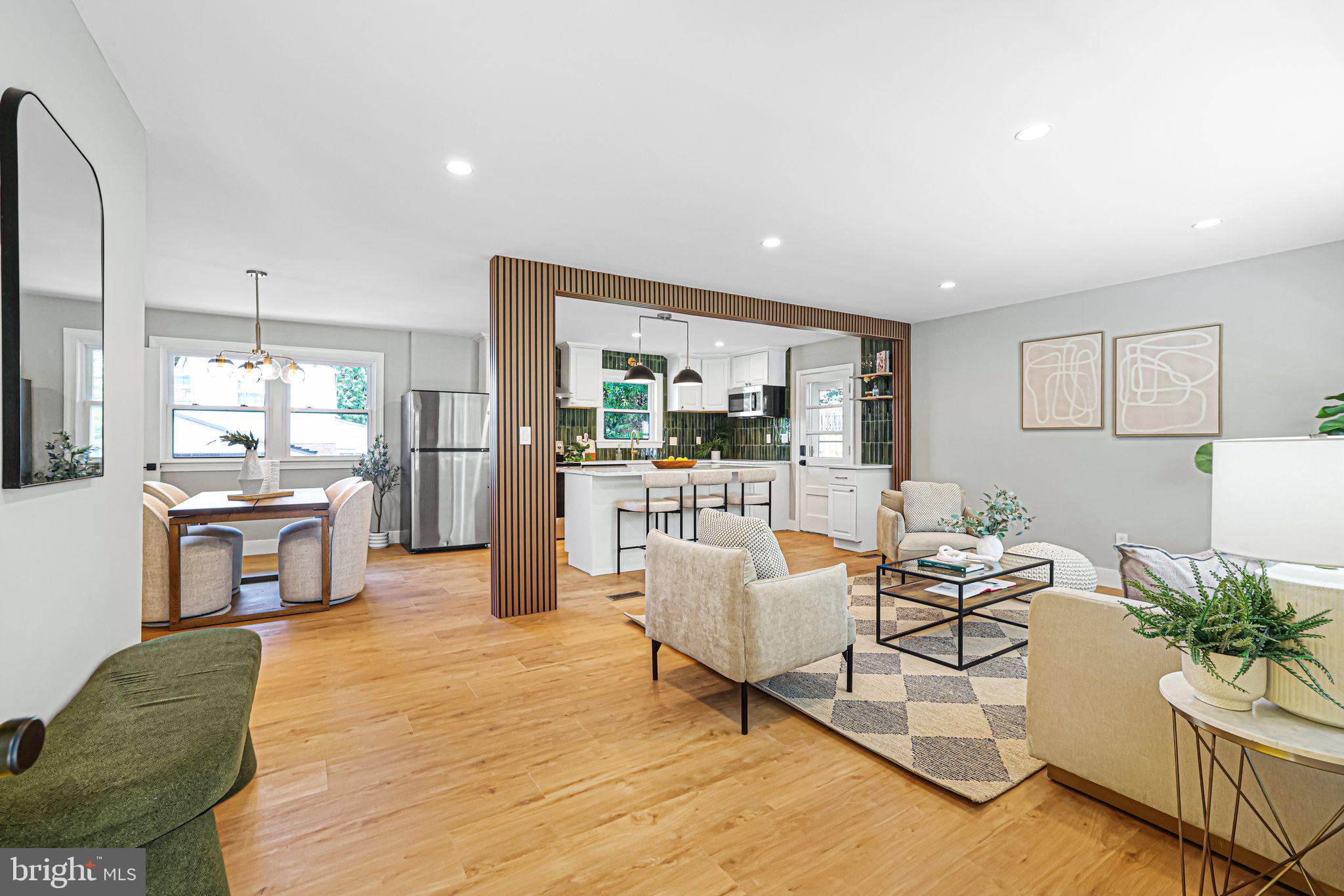 12300 La Plata Street Silver Spring, MD 20904 - Photo 7 of 45 a living room with furniture and a kitchen area
