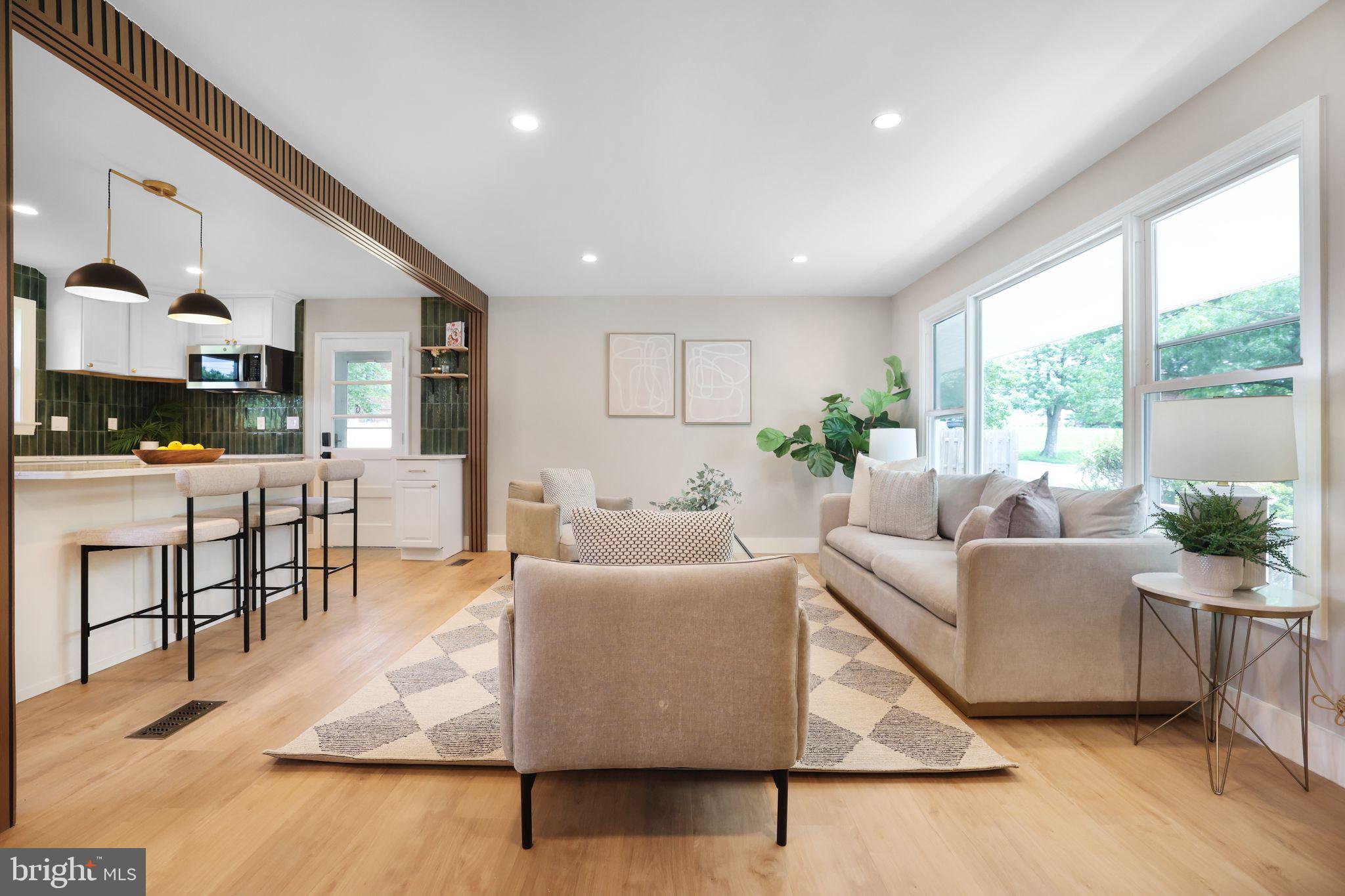 12300 La Plata Street Silver Spring, MD 20904 - Photo 8 of 45 a living room with furniture wooden floor and a large window