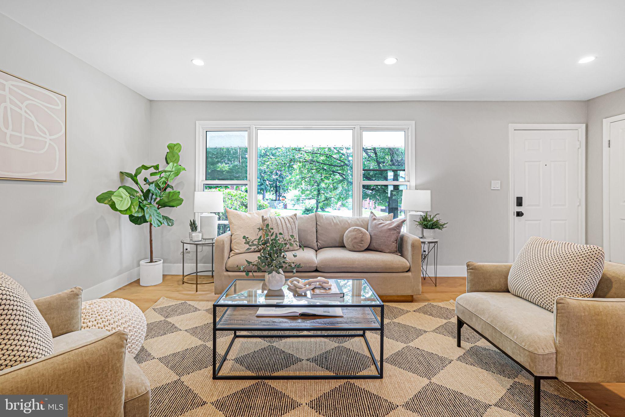 12300 La Plata Street Silver Spring, MD 20904 - Photo 9 of 45 a living room with furniture potted plant and a large window
