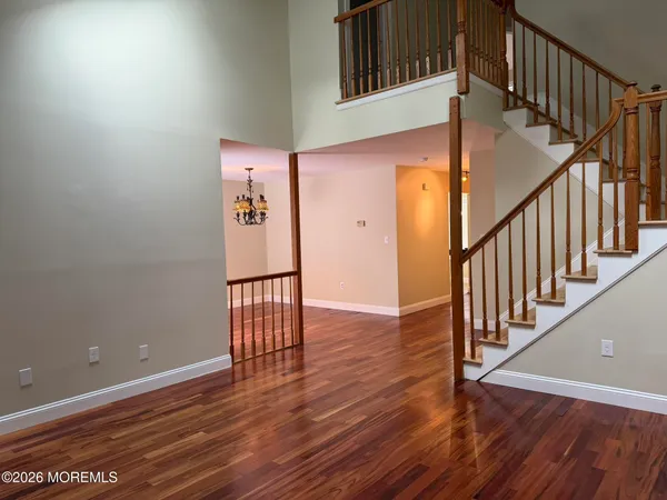 a view of an entryway with wooden floor