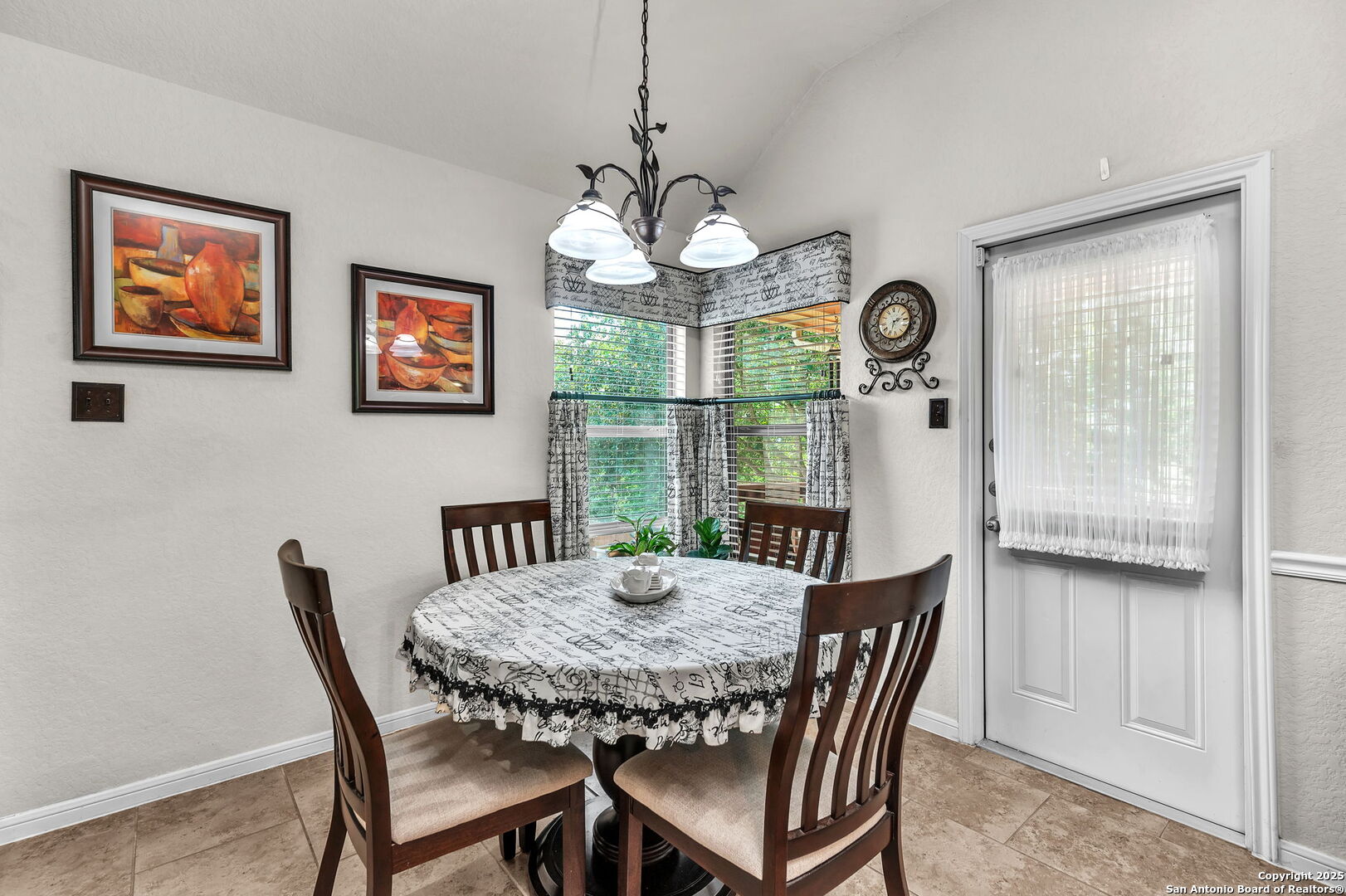5809 Devonwood Street Schertz, TX 78108 - Photo 12 of 26 a view of a dining room with furniture window and wooden floor