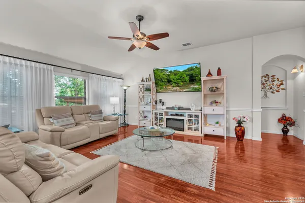 a living room with furniture and a large window