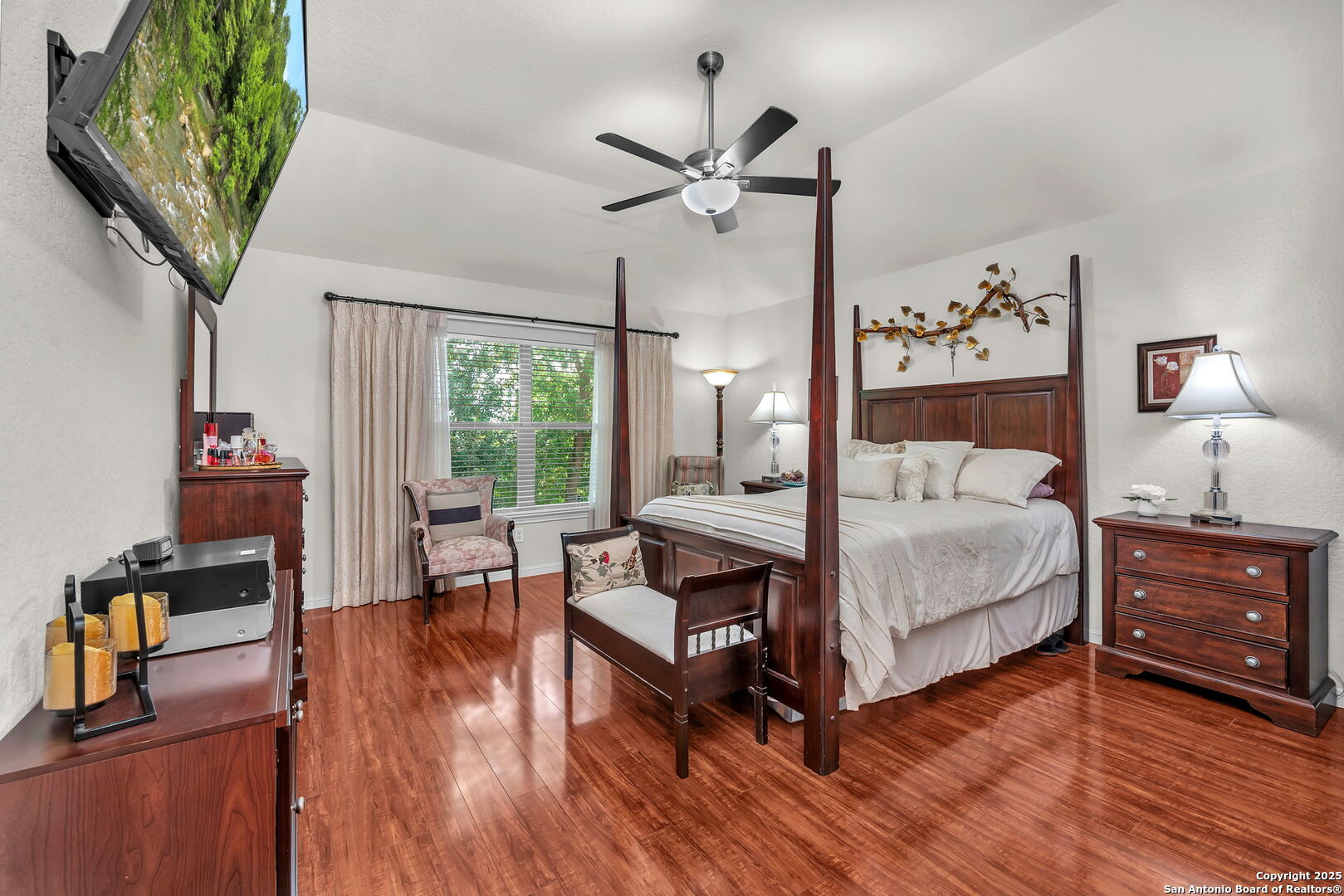 5809 Devonwood Street Schertz, TX 78108 - Photo 18 of 26 a bedroom with a bed and wooden floor