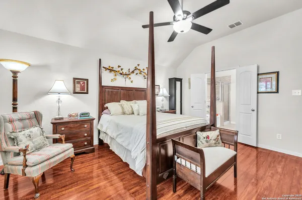 a bed room with a bed and a chandelier