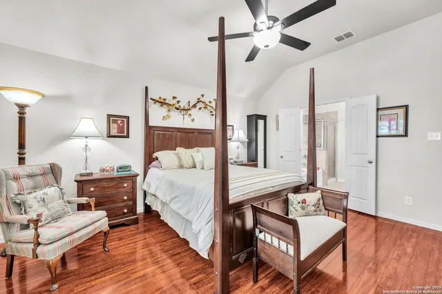 a bed room with a bed and a chandelier