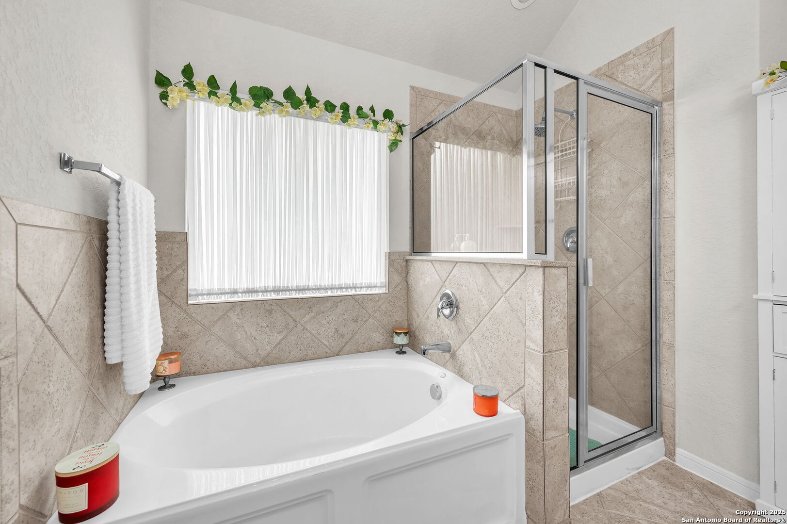 5809 Devonwood Street Schertz, TX 78108 - Photo 21 of 26 a bathroom with a bathtub and a shower