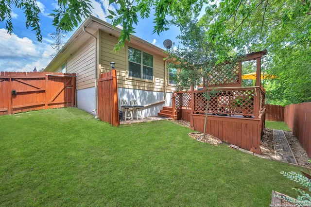 a view of backyard with green space