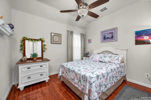 a bedroom with a bed and a dresser