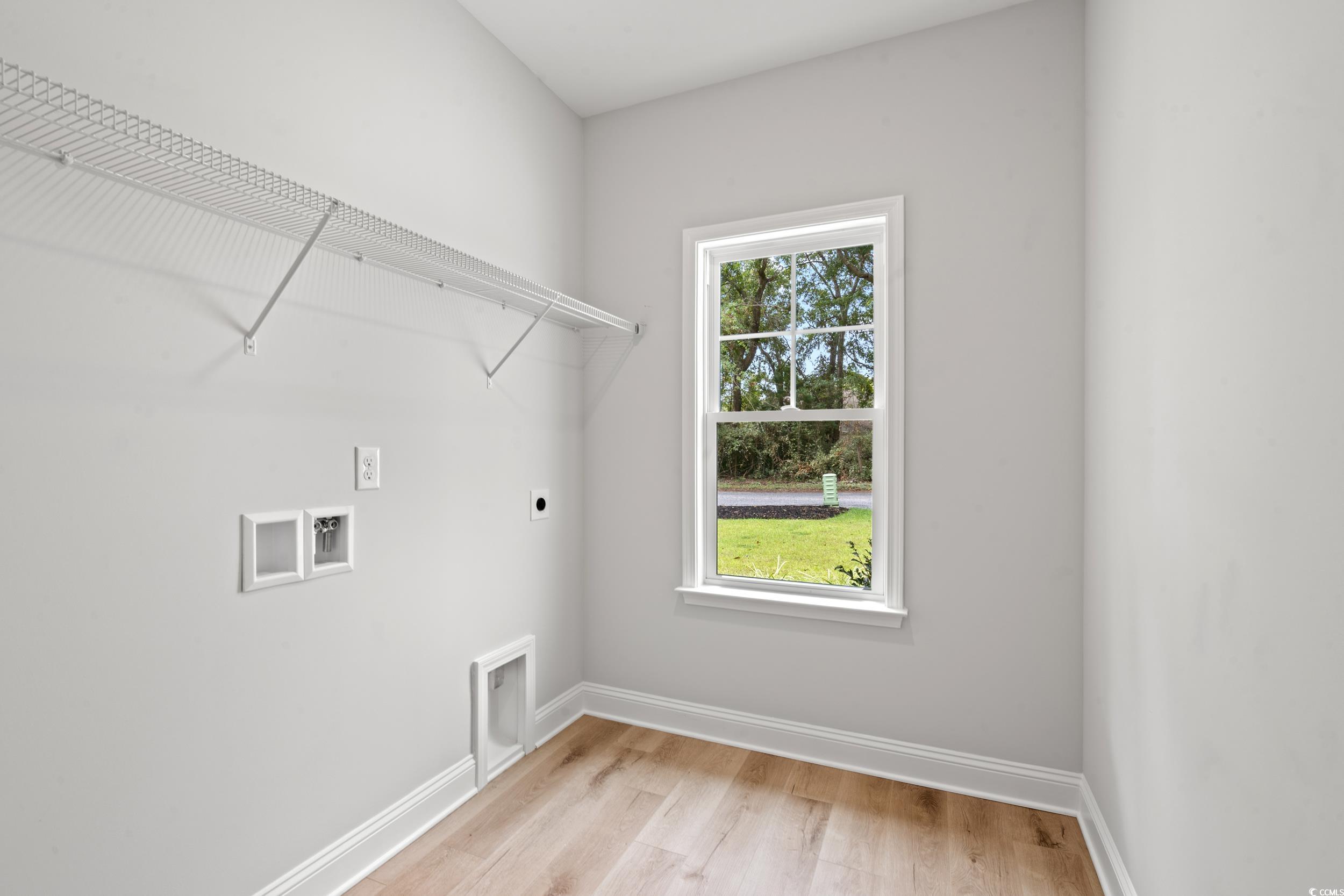 220 Ford Road Pawleys Island, SC 29585 - Photo 14 of 18 Laundry area with light wood-style flooring, electric dryer hookup, and washer hookup