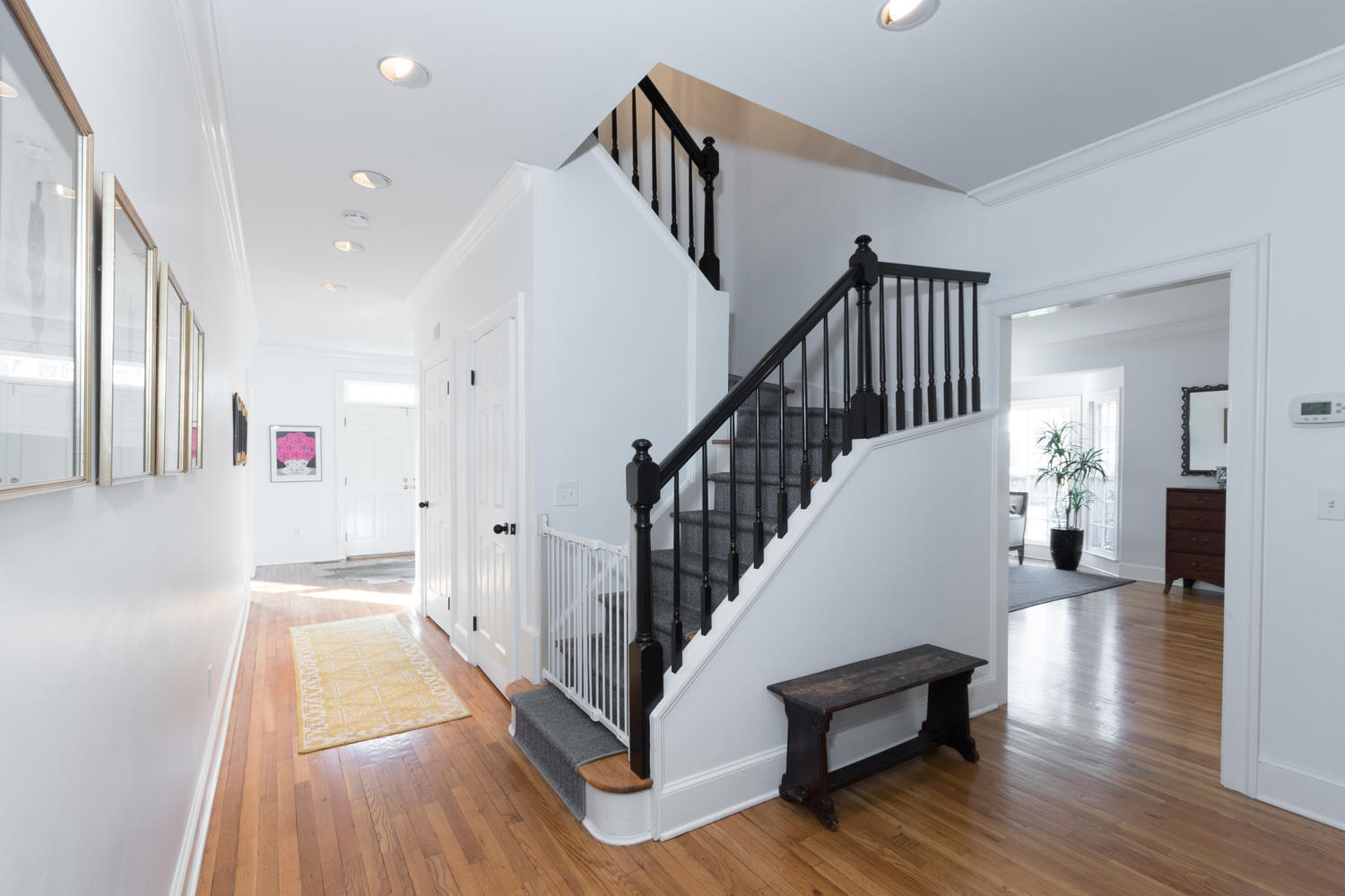7 Hunt Road Darien, CT 06820 - Photo 18 of 40 a view of staircase and kitchen with wooden floor
