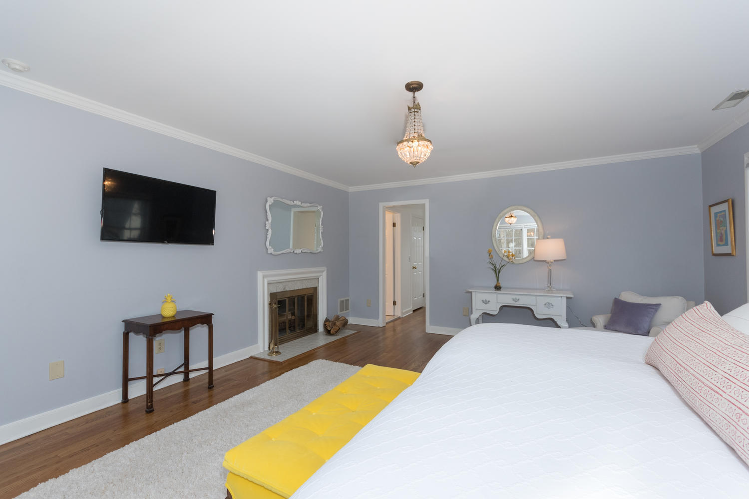 7 Hunt Road Darien, CT 06820 - Photo 22 of 40 a bedroom with a bed and a flat screen tv