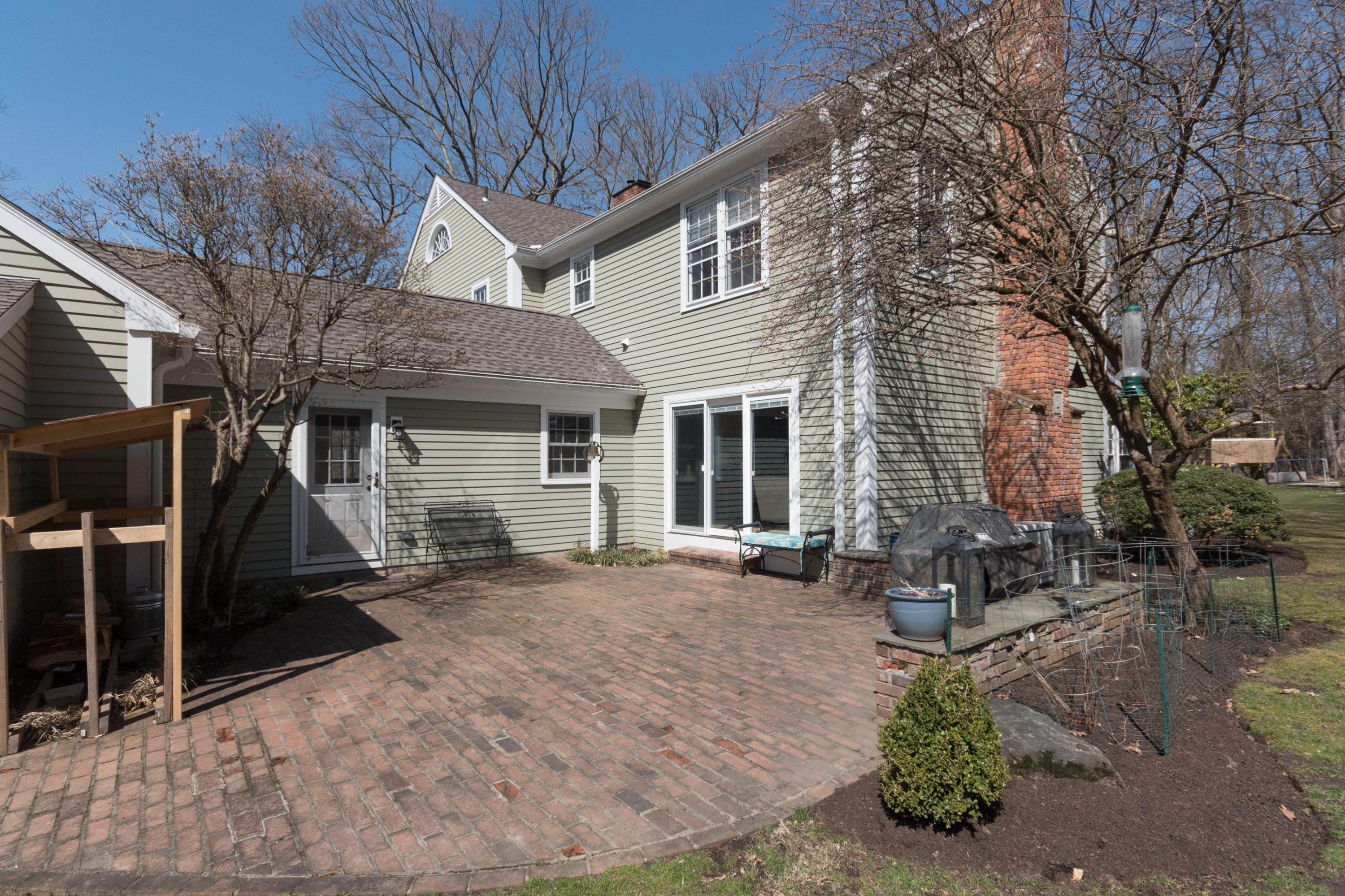 7 Hunt Road Darien, CT 06820 - Photo 33 of 40 a view of a house with a patio
