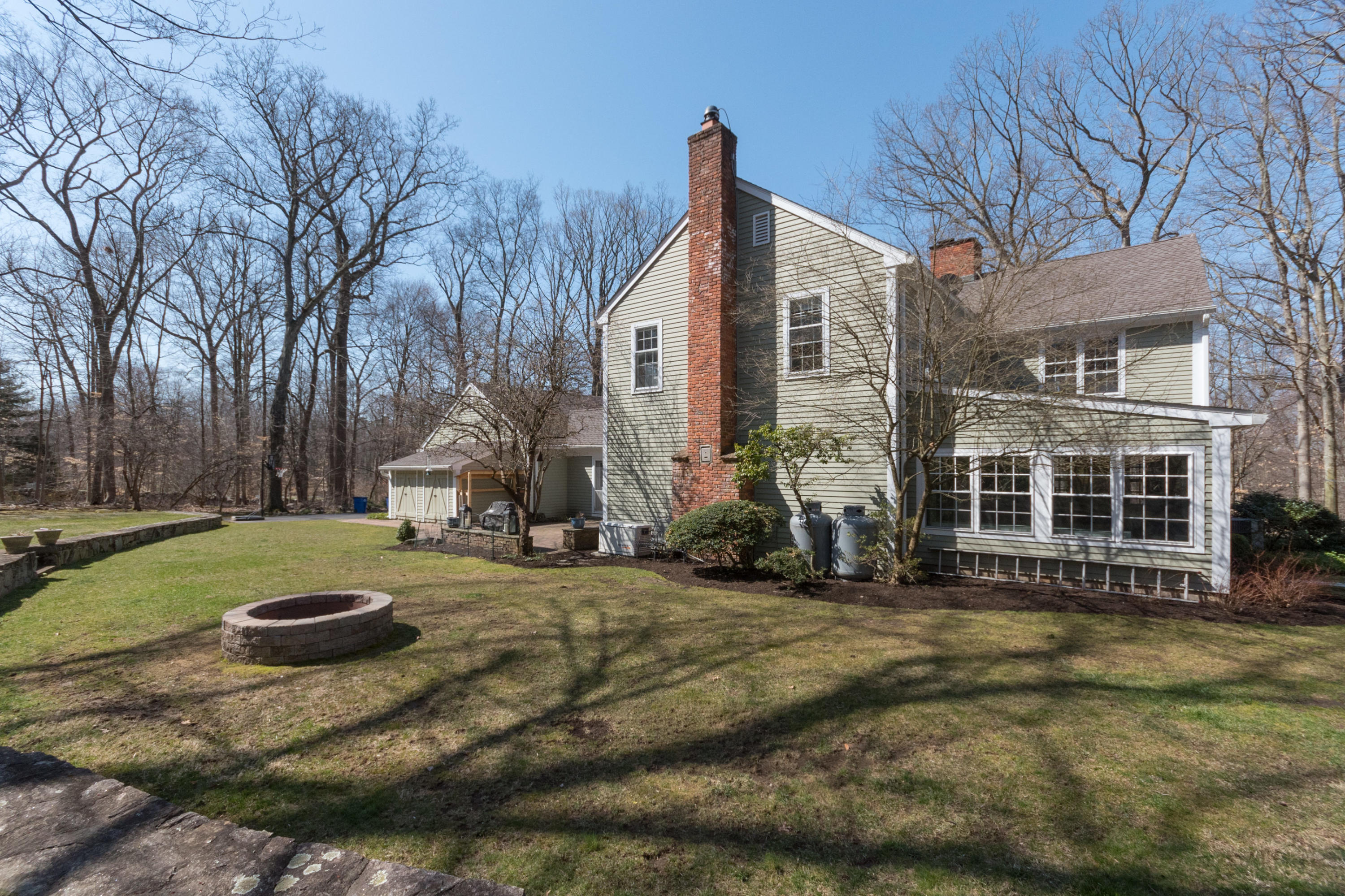 7 Hunt Road Darien, CT 06820 - Photo 35 of 40 a view of a house with backyard and trees