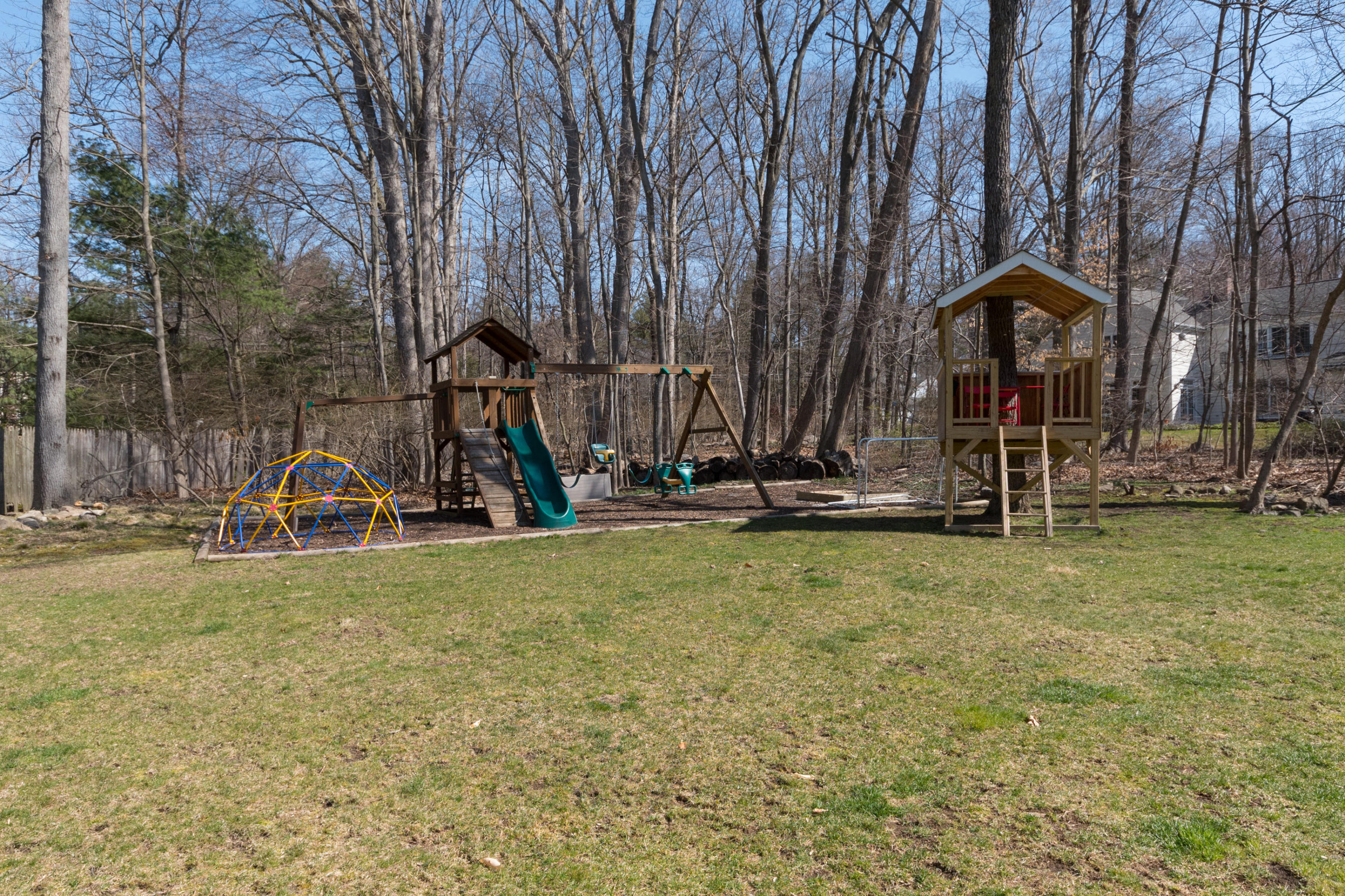 7 Hunt Road Darien, CT 06820 - Photo 37 of 40 a view of a park with swings and slides