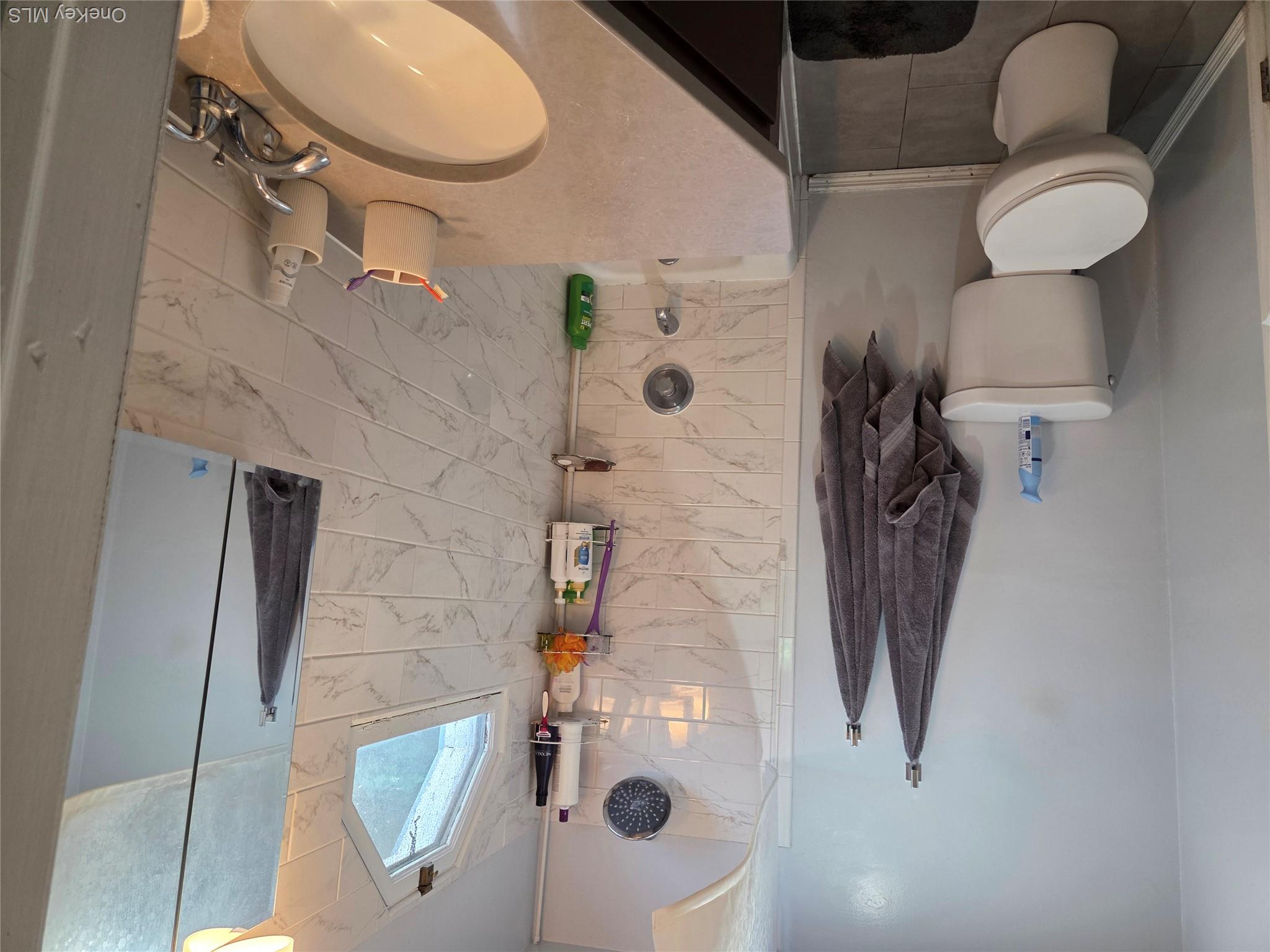 342 Coldenham Road Walden, NY 12586 - Photo 7 of 20 a bathroom with a sink toilet and shower