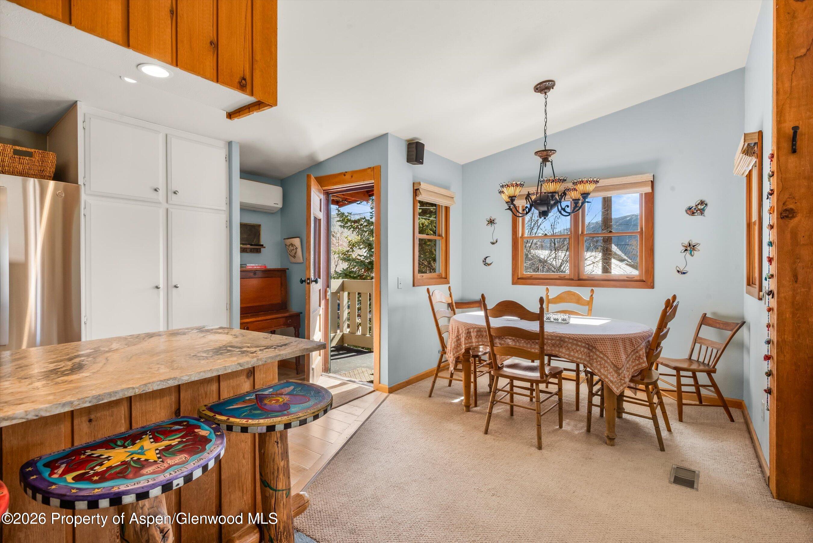 120 Tucker Lane Basalt, CO 81621 - Photo 11 of 33 a view of a dining room with furniture window and wooden floor