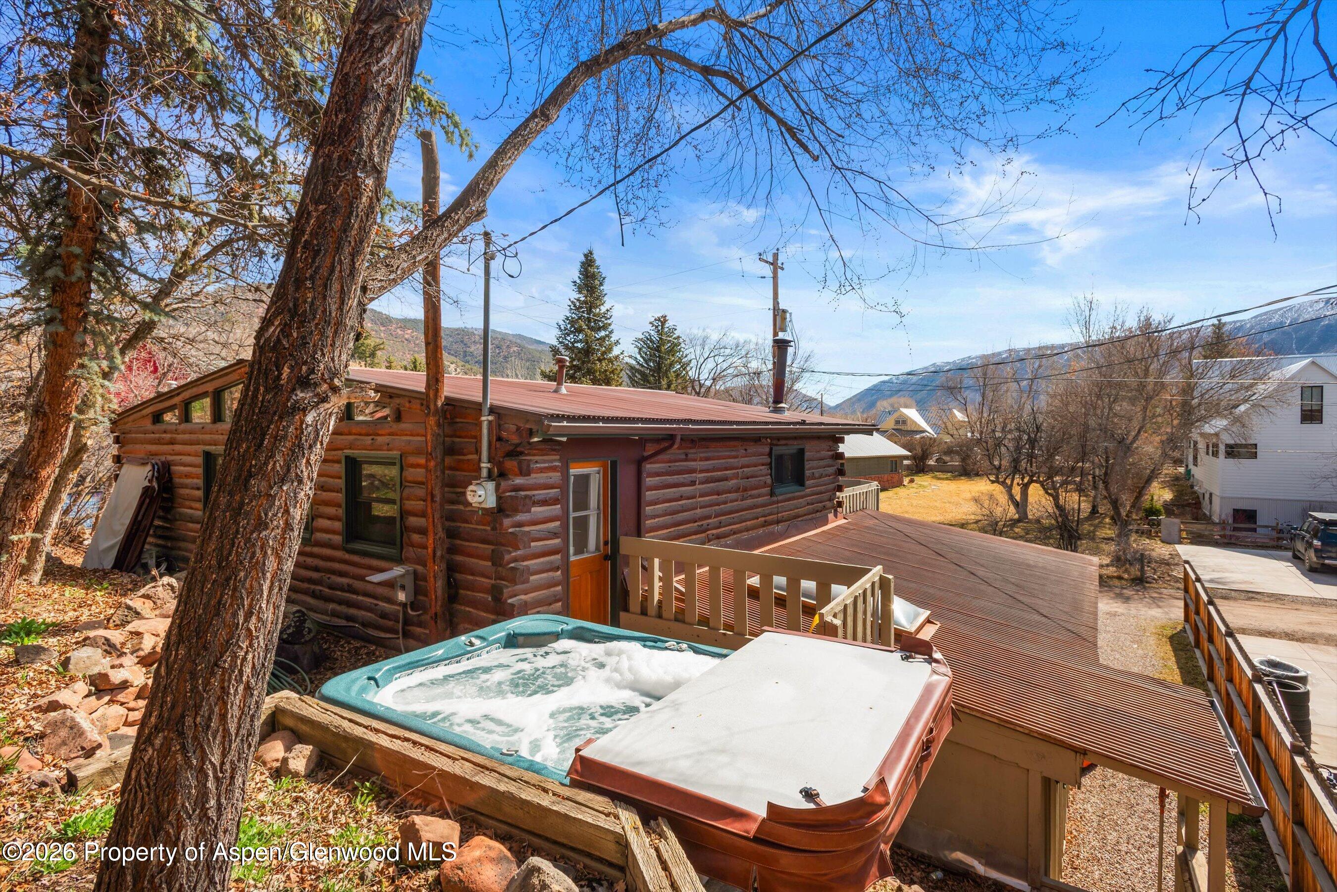 120 Tucker Lane Basalt, CO 81621 - Photo 12 of 33 a view of a patio with table and chairs with wooden floor and fence