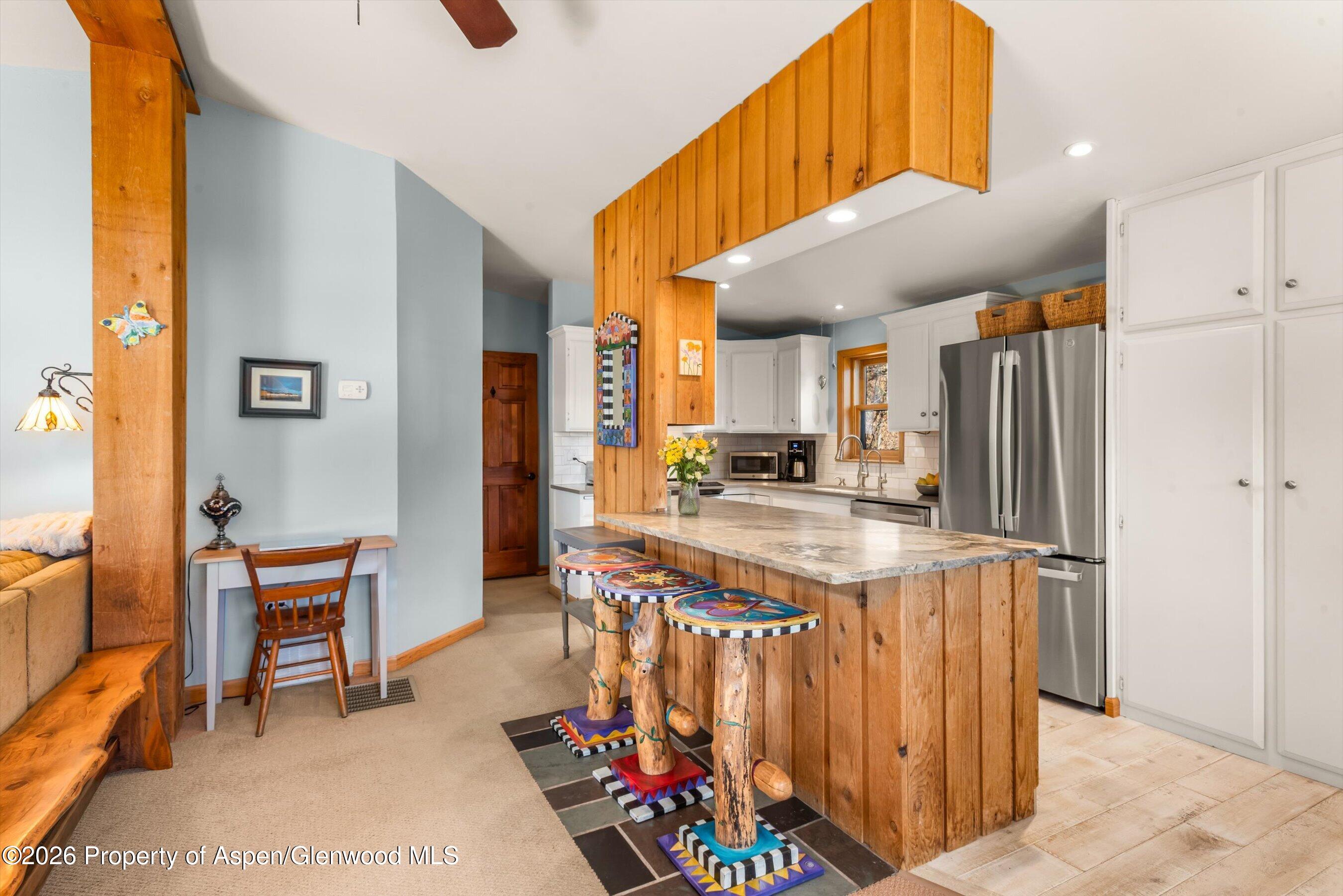 120 Tucker Lane Basalt, CO 81621 - Photo 14 of 33 a kitchen with stainless steel appliances granite countertop a sink and a refrigerator