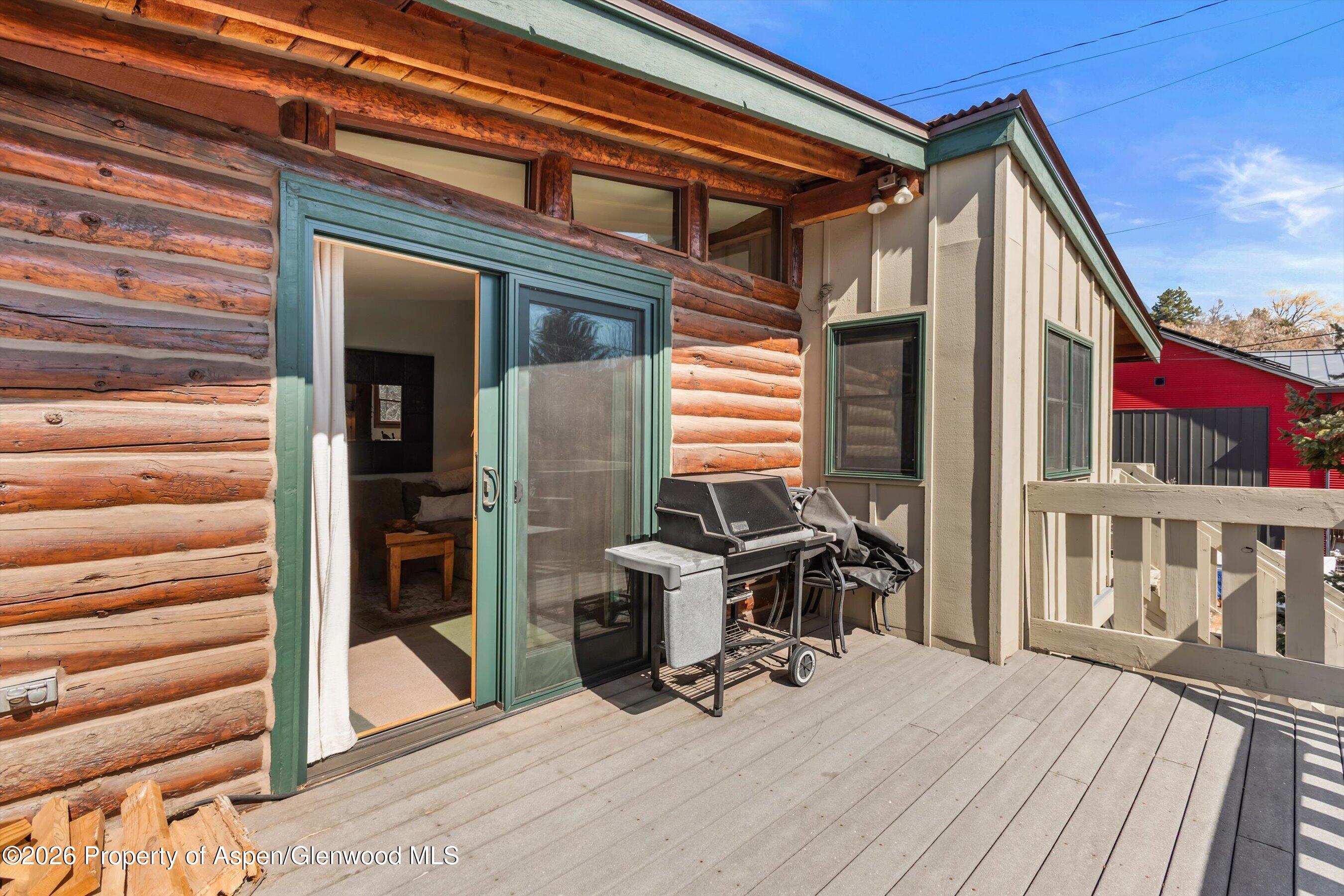 120 Tucker Lane Basalt, CO 81621 - Photo 17 of 33 a view of a patio with a table and chairs and wooden floor