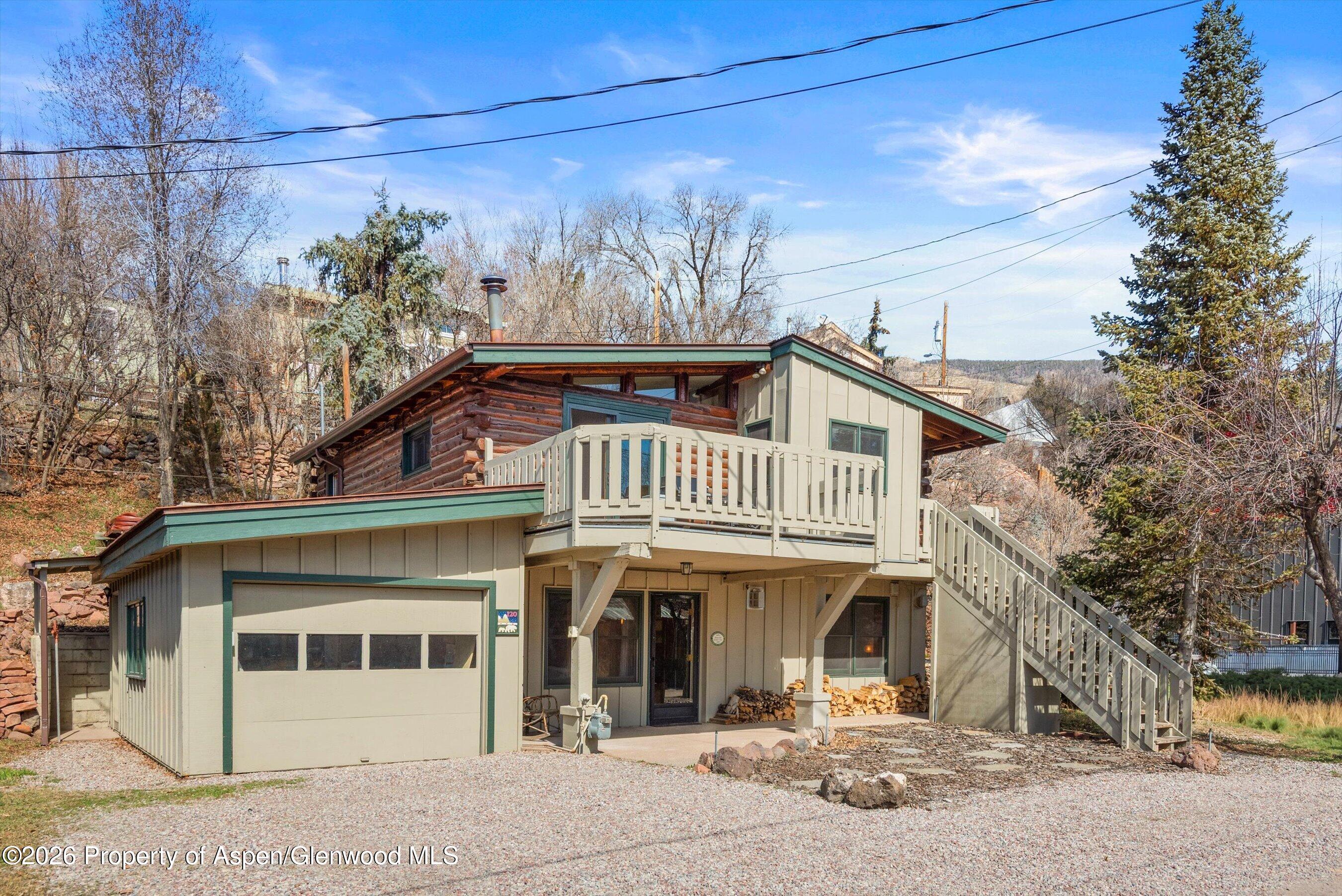 120 Tucker Lane Basalt, CO 81621 - Photo 2 of 33 a front view of a house with a yard and potted plants