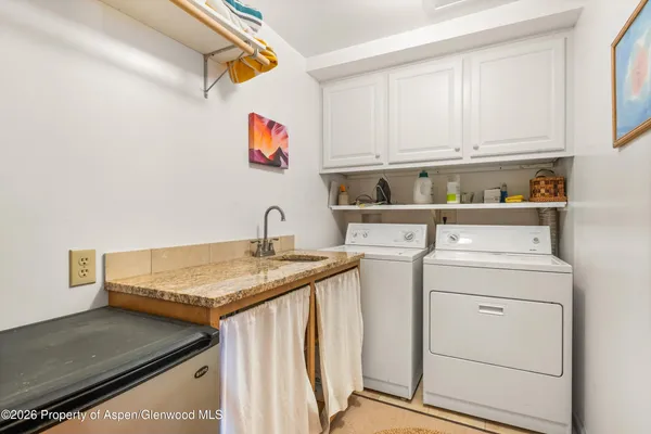 a utility room with dryer and washer