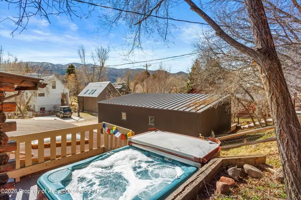 a view of a balcony with two chairs