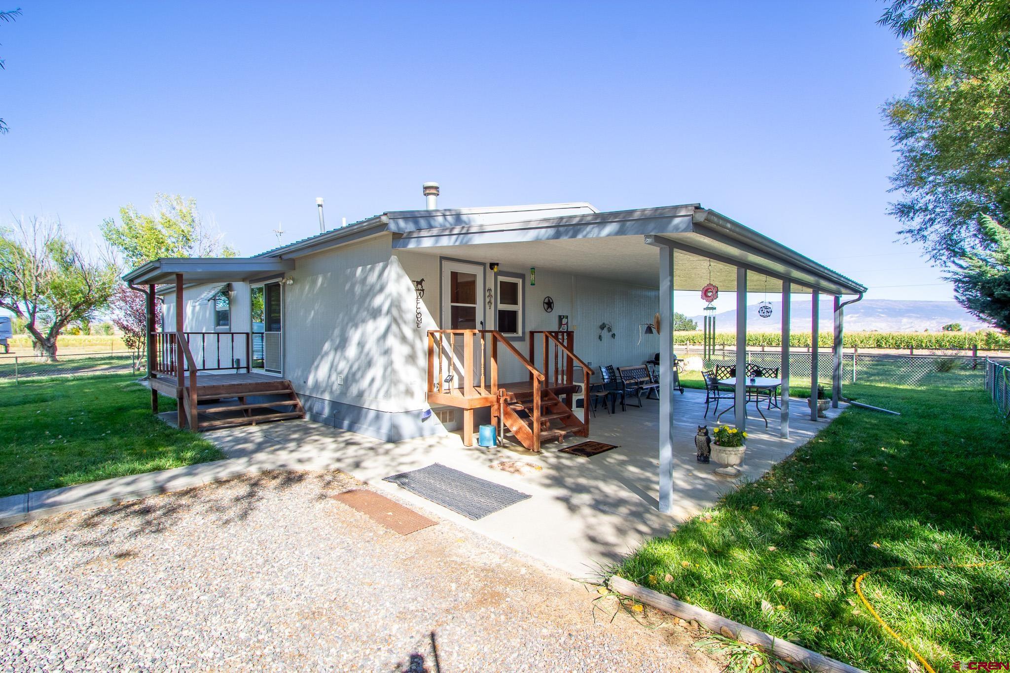 13648 B Road Delta, CO 81416 - Photo 11 of 35 a view of a house with backyard and garden