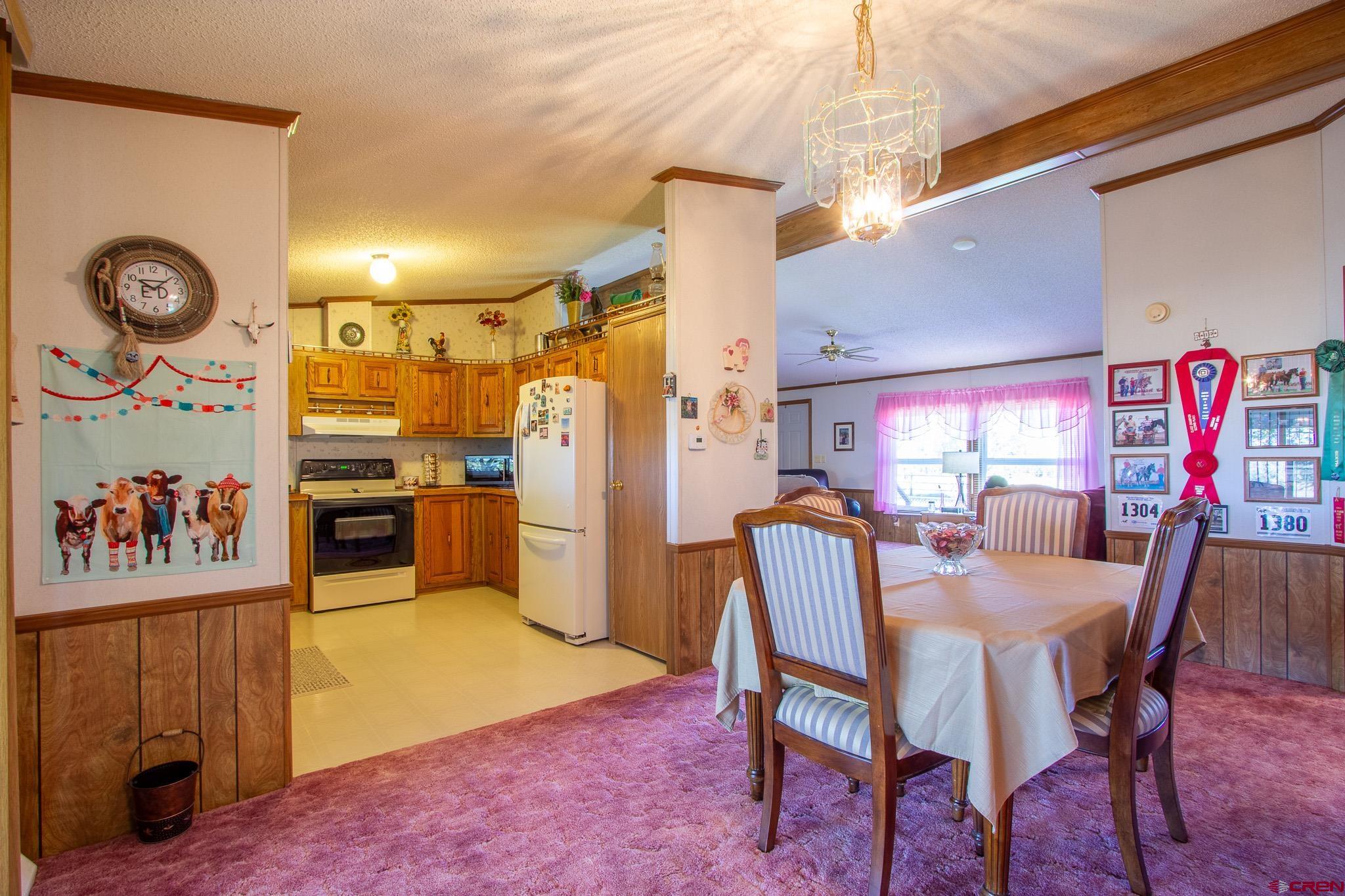 13648 B Road Delta, CO 81416 - Photo 14 of 35 a view of a dining room with furniture and window