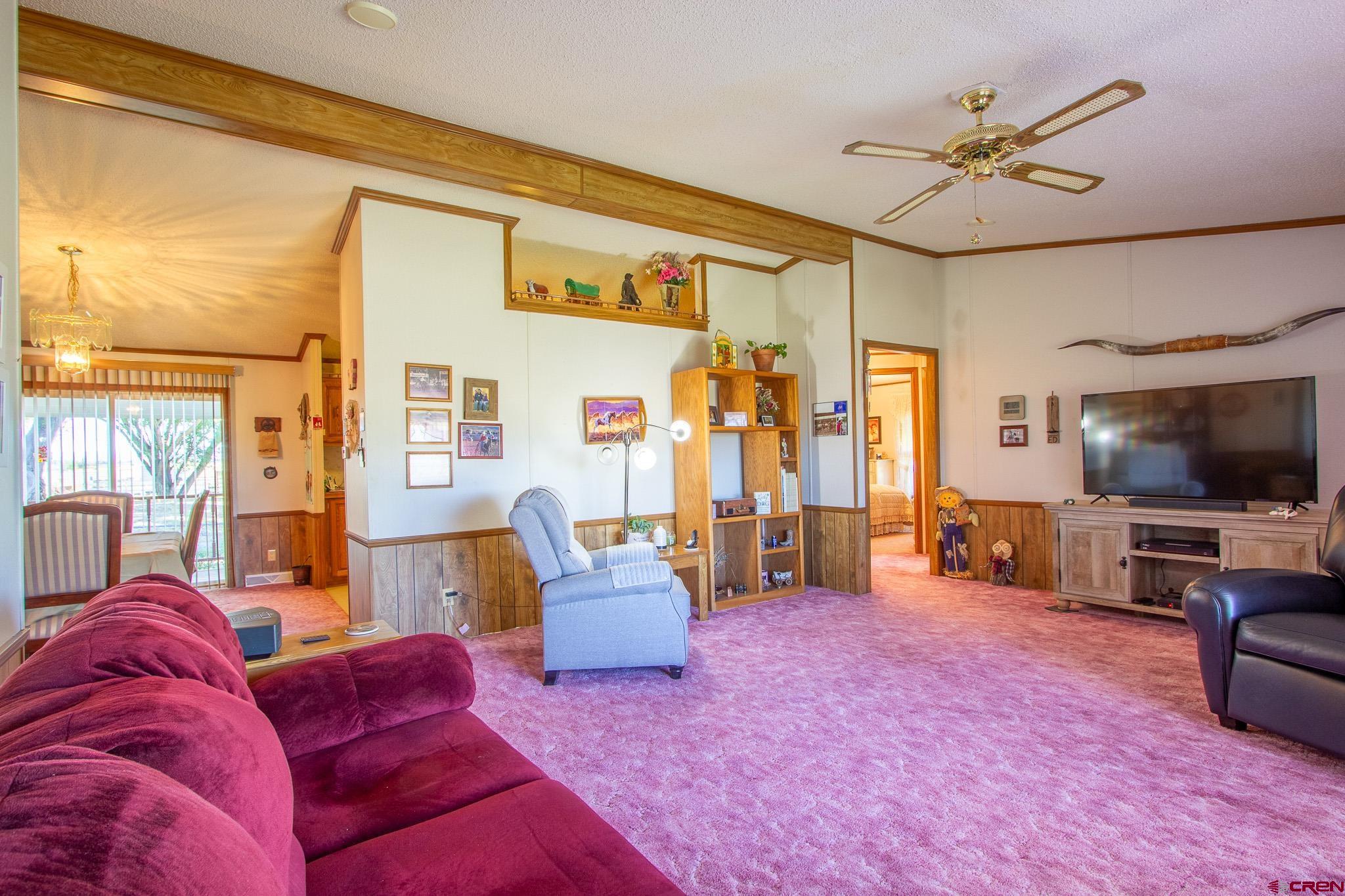 13648 B Road Delta, CO 81416 - Photo 18 of 35 a living room with furniture and a flat screen tv
