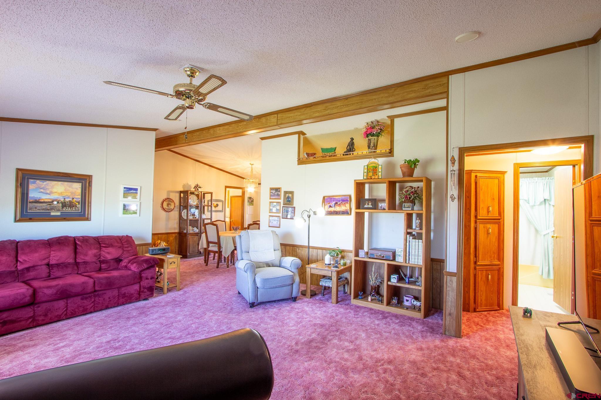 13648 B Road Delta, CO 81416 - Photo 19 of 35 a living room with furniture and large window