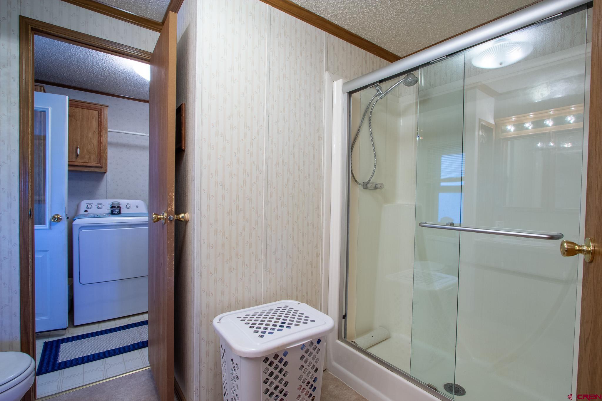 13648 B Road Delta, CO 81416 - Photo 23 of 35 a bathroom with a shower and a sink
