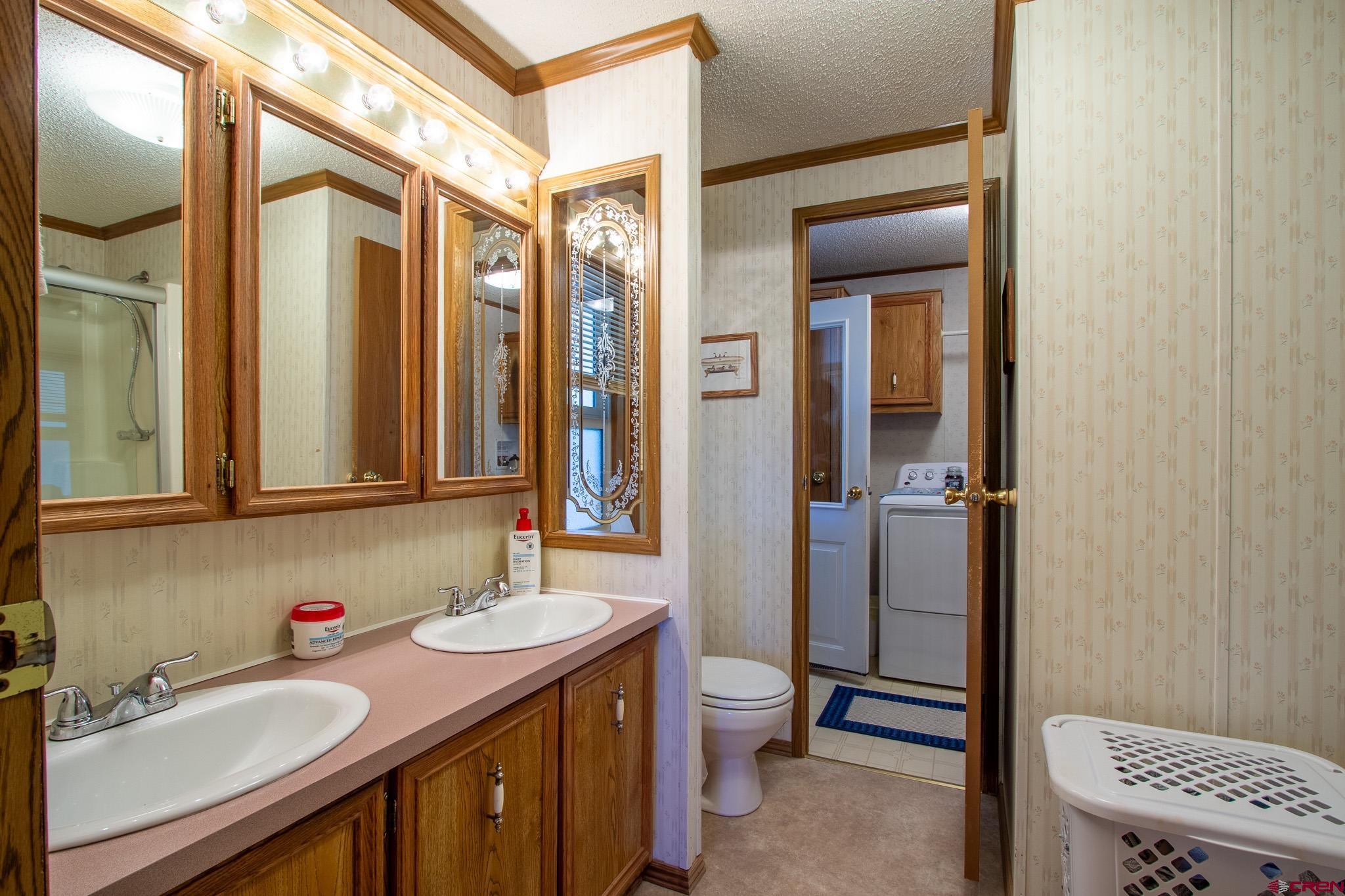 13648 B Road Delta, CO 81416 - Photo 25 of 35 a bathroom with a sink a toilet and shower