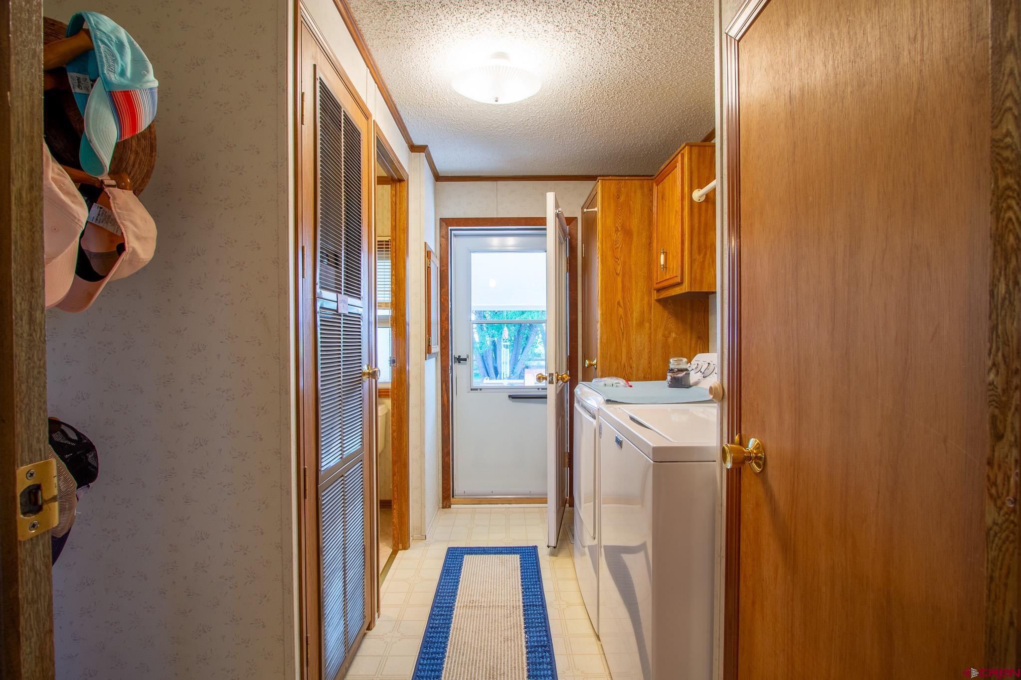 13648 B Road Delta, CO 81416 - Photo 28 of 35 a view of a hallway with wooden floor and entryway
