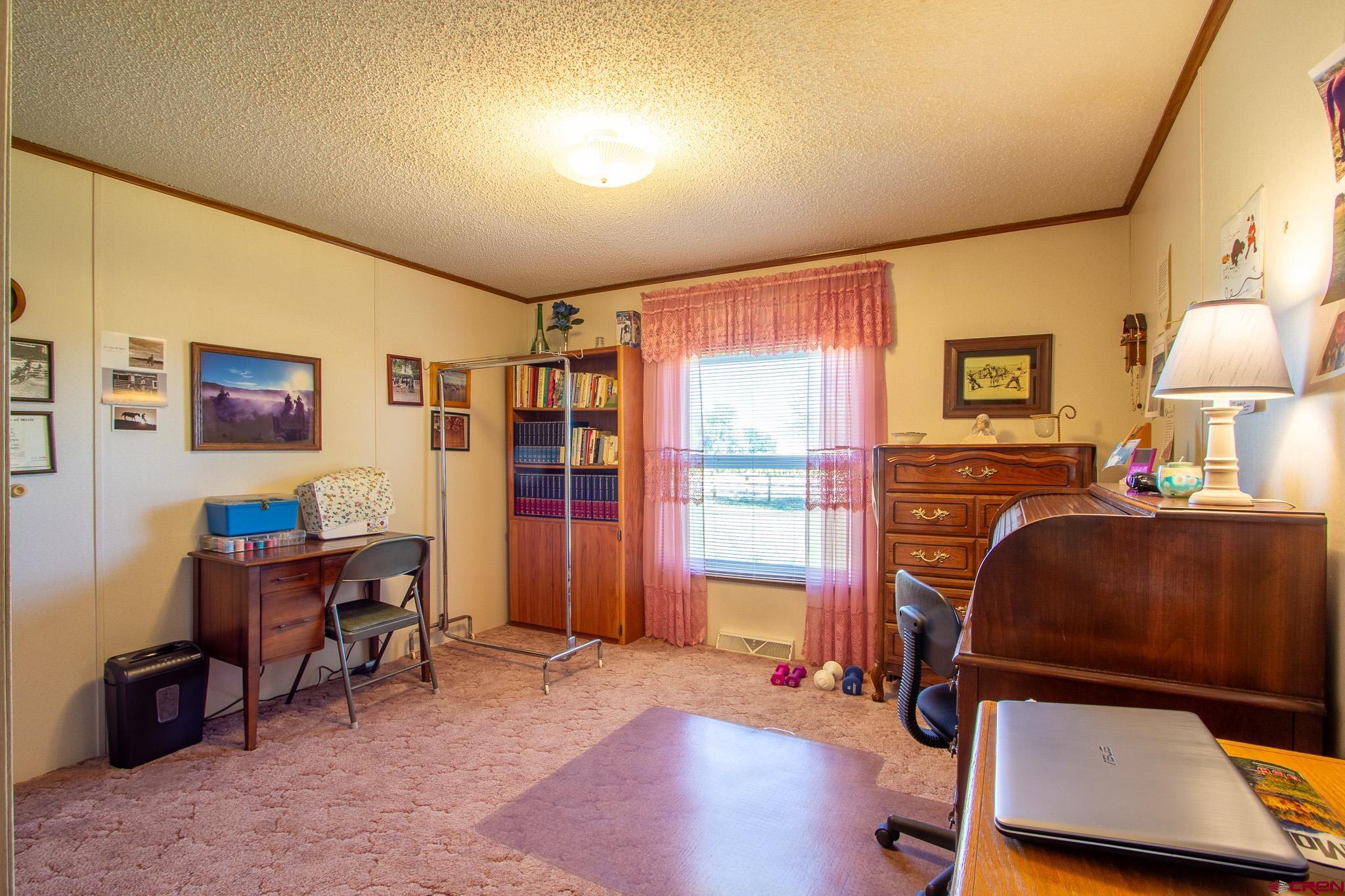 13648 B Road Delta, CO 81416 - Photo 30 of 35 a room with furniture and a window