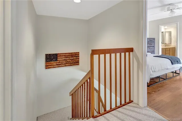 a view of a hallway with a staircase
