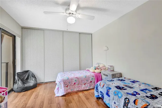 a bedroom with a bed and hallway