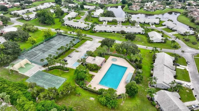an aerial view of residential houses with outdoor space