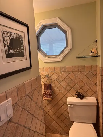 a bathroom with a toilet and a sink