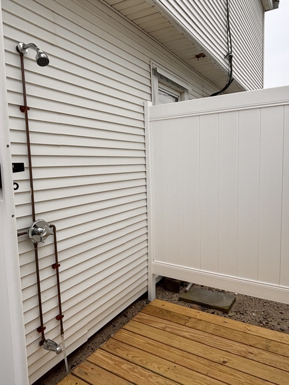 20 Humarock Beach, Unit 1 Scituate, MA 02066 - Photo 19 of 20 a view of a utility room with wooden floor