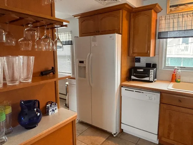 a kitchen with stainless steel appliances a refrigerator and a sink
