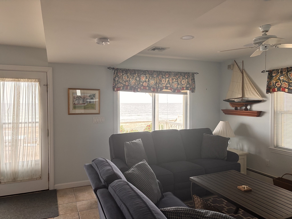 20 Humarock Beach, Unit 1 Scituate, MA 02066 - Photo 7 of 20 a living room with furniture and a window
