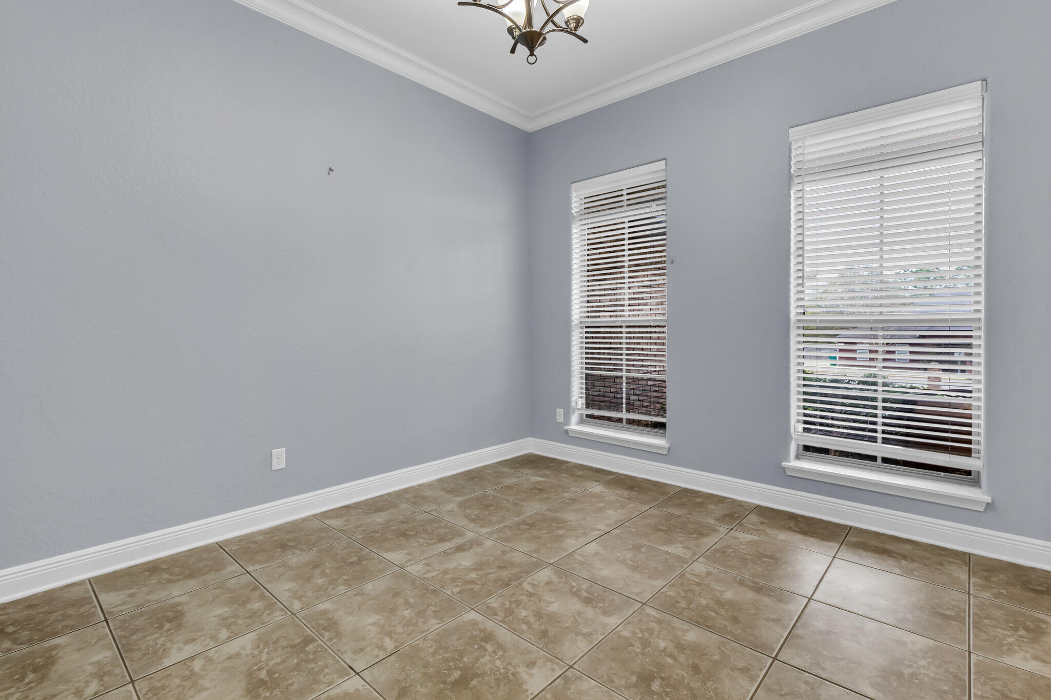 6181 Hummingbird Lane Crestview, FL 32536 - Photo 13 of 46 a view of an empty room with a window