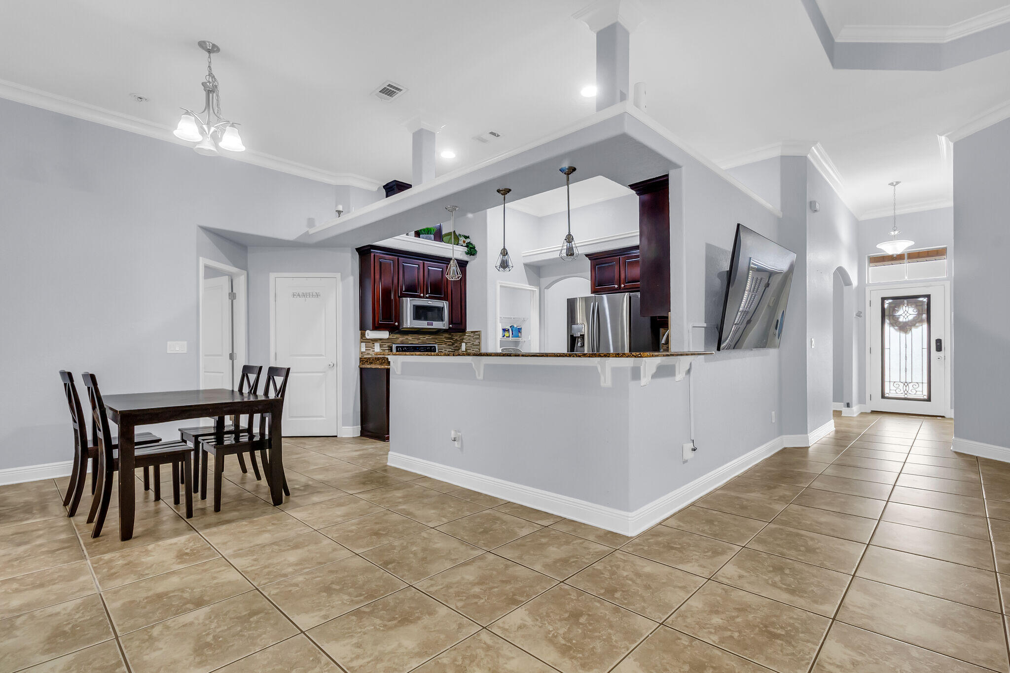 6181 Hummingbird Lane Crestview, FL 32536 - Photo 16 of 46 a view of a kitchen with cabinets and wooden floor