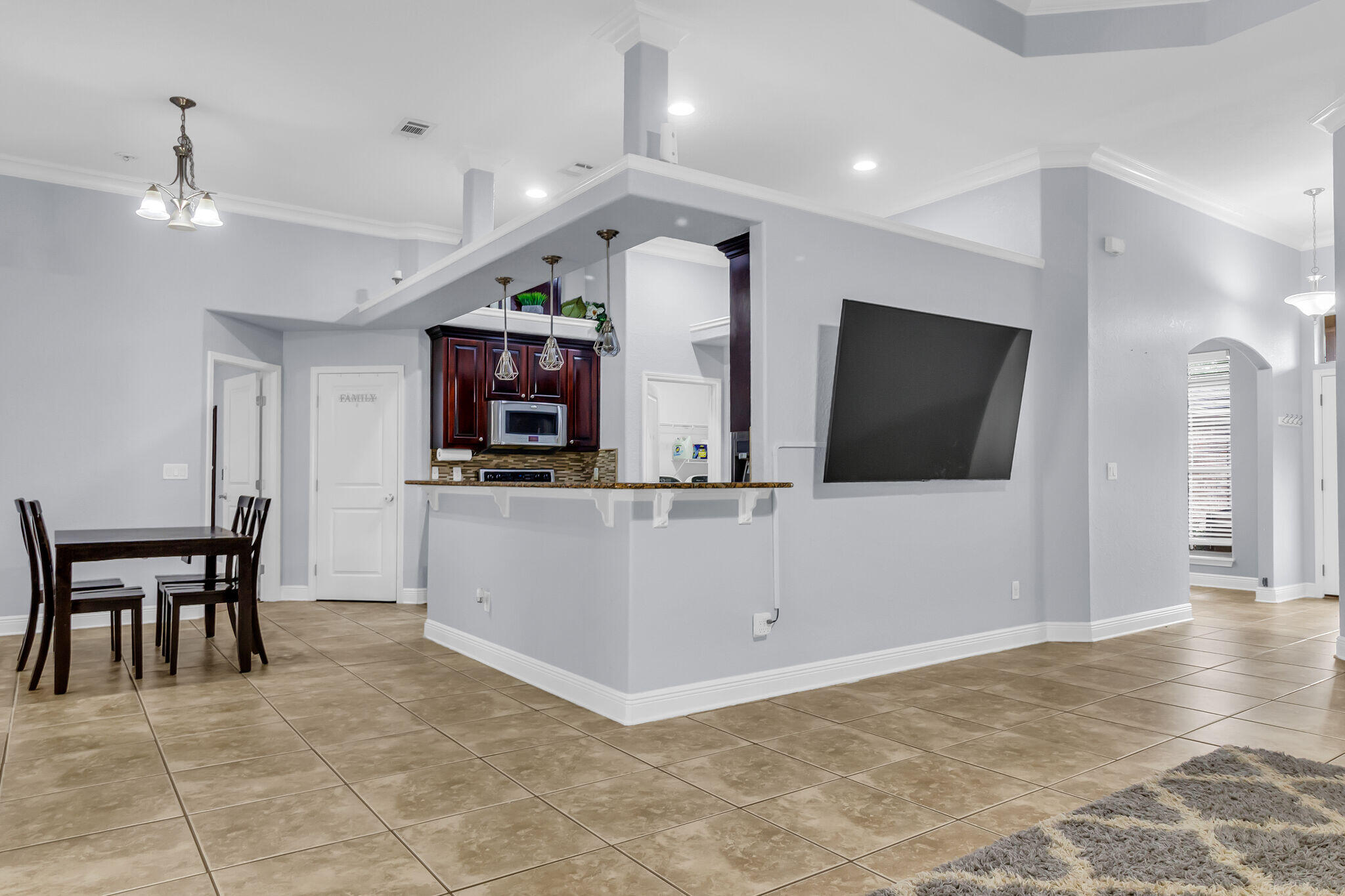 6181 Hummingbird Lane Crestview, FL 32536 - Photo 17 of 46 a view of a livingroom with furniture and a flat screen tv