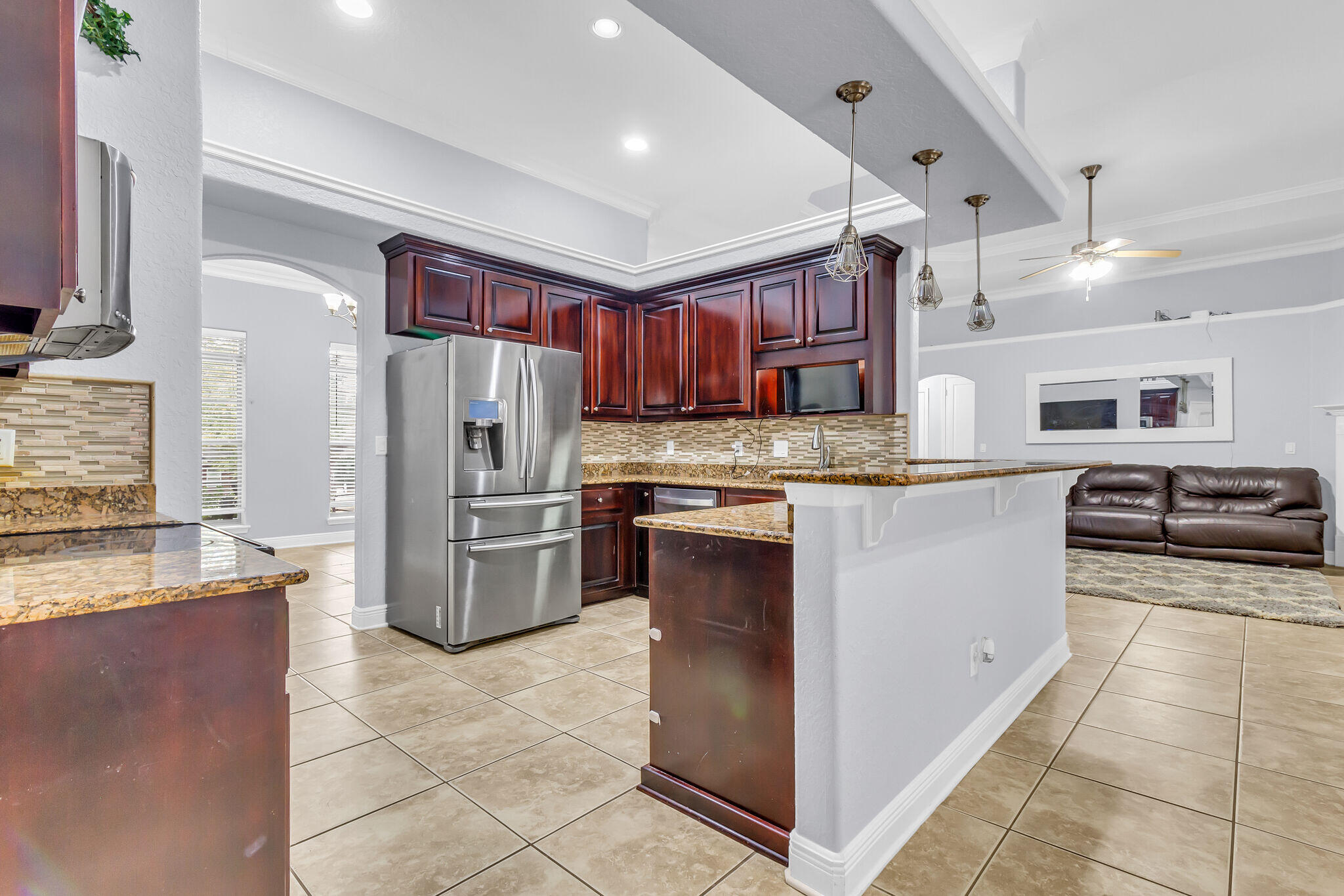 6181 Hummingbird Lane Crestview, FL 32536 - Photo 18 of 46 a kitchen with stainless steel appliances granite countertop a refrigerator and a stove
