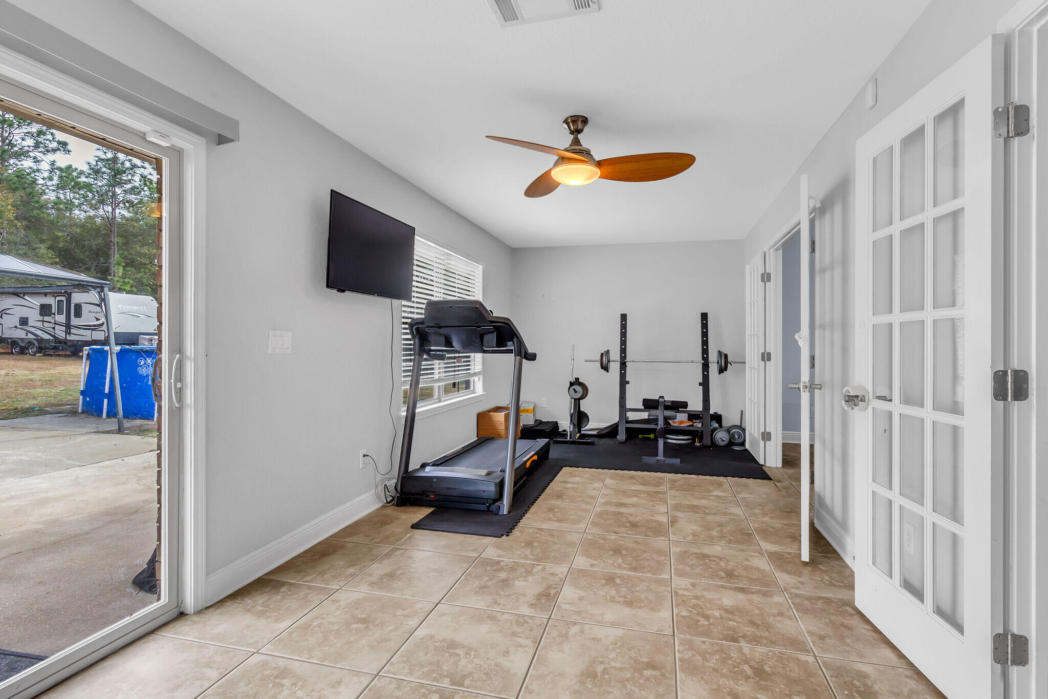 6181 Hummingbird Lane Crestview, FL 32536 - Photo 24 of 46 a view of living room filled with furniture and a flat screen tv