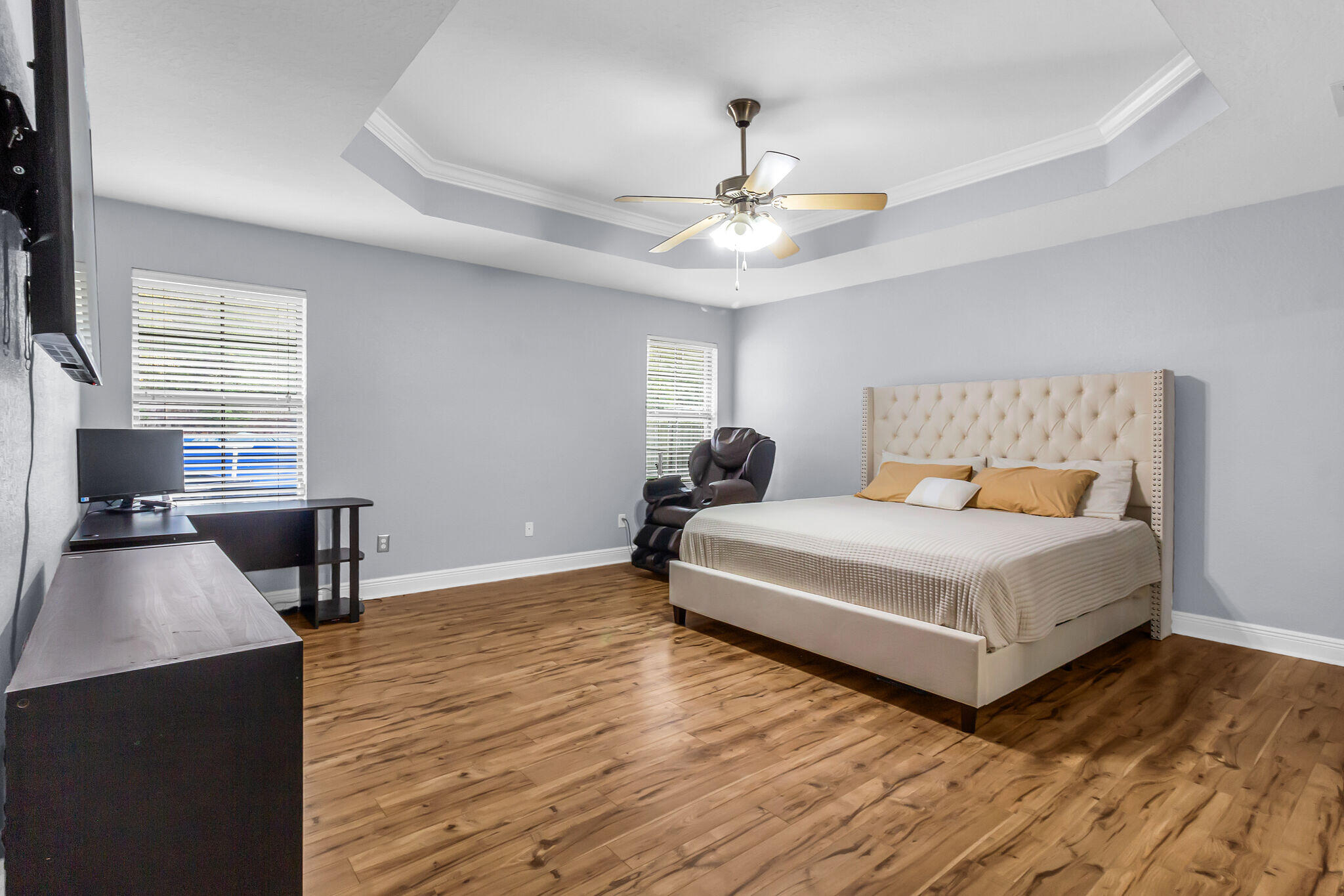 6181 Hummingbird Lane Crestview, FL 32536 - Photo 25 of 46 a bedroom with a bed and a chandelier