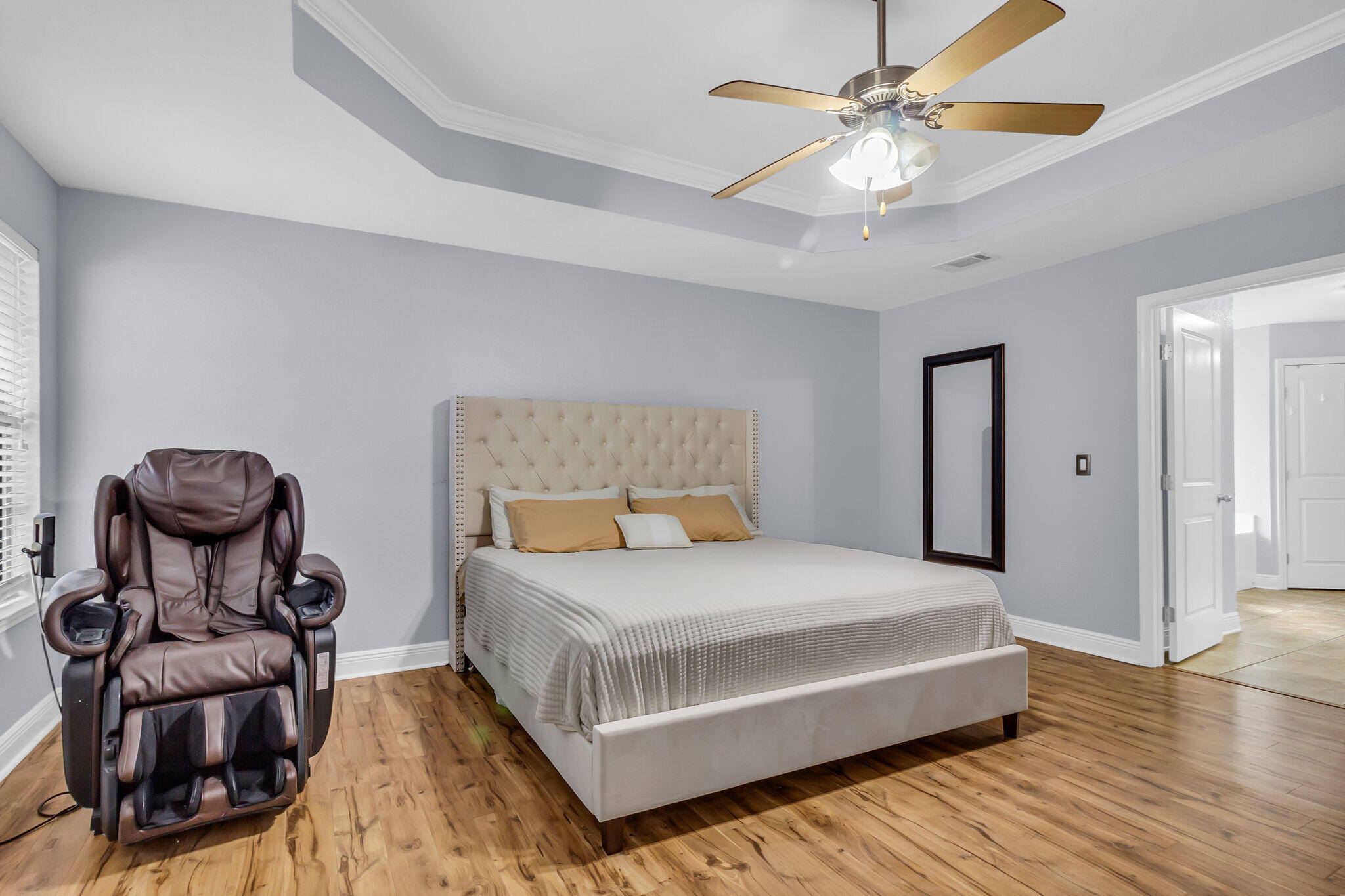 6181 Hummingbird Lane Crestview, FL 32536 - Photo 26 of 46 a bedroom with a bed and a chandelier