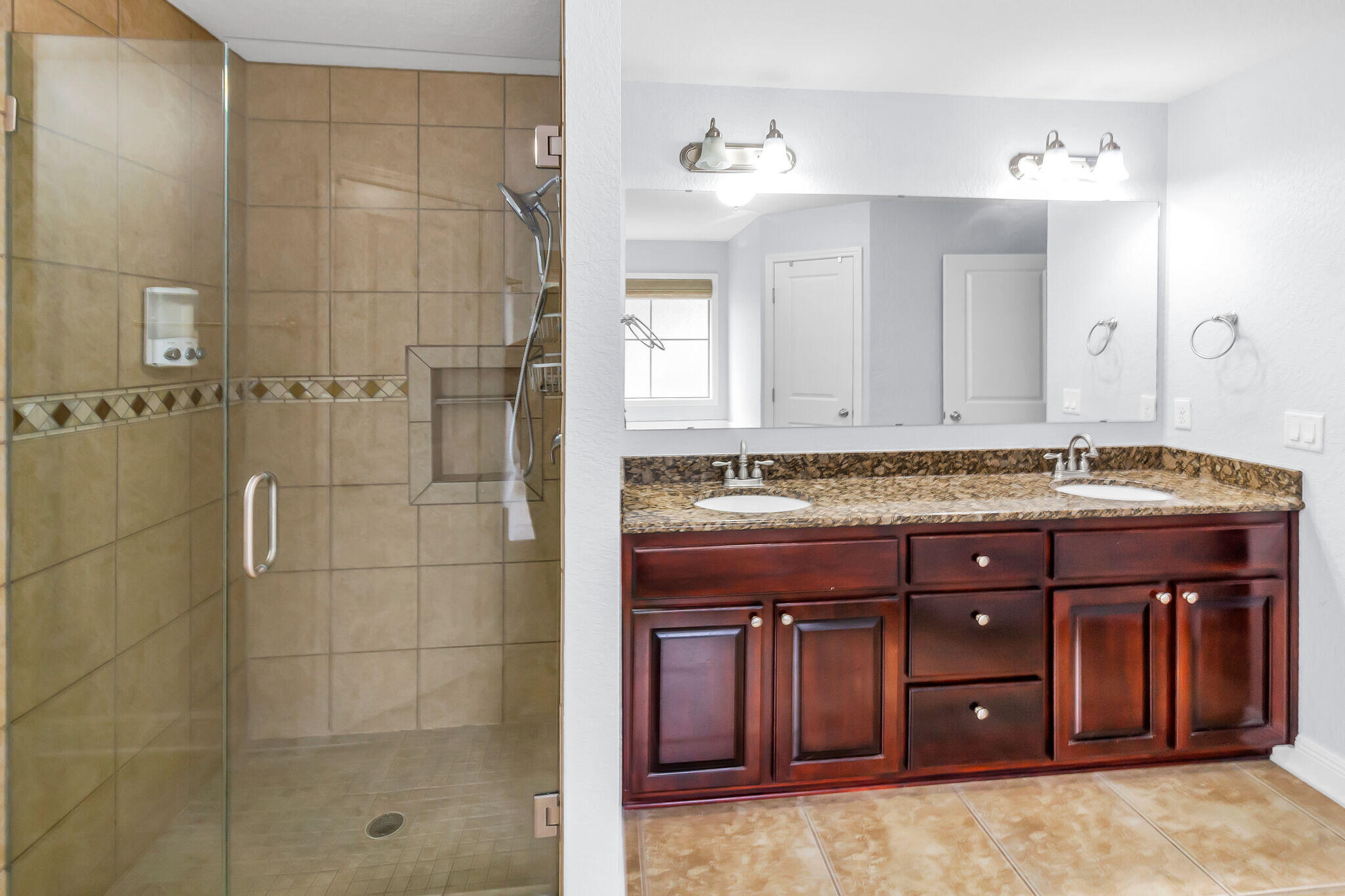 6181 Hummingbird Lane Crestview, FL 32536 - Photo 30 of 46 a bathroom with a granite countertop sink a vanity and a mirror