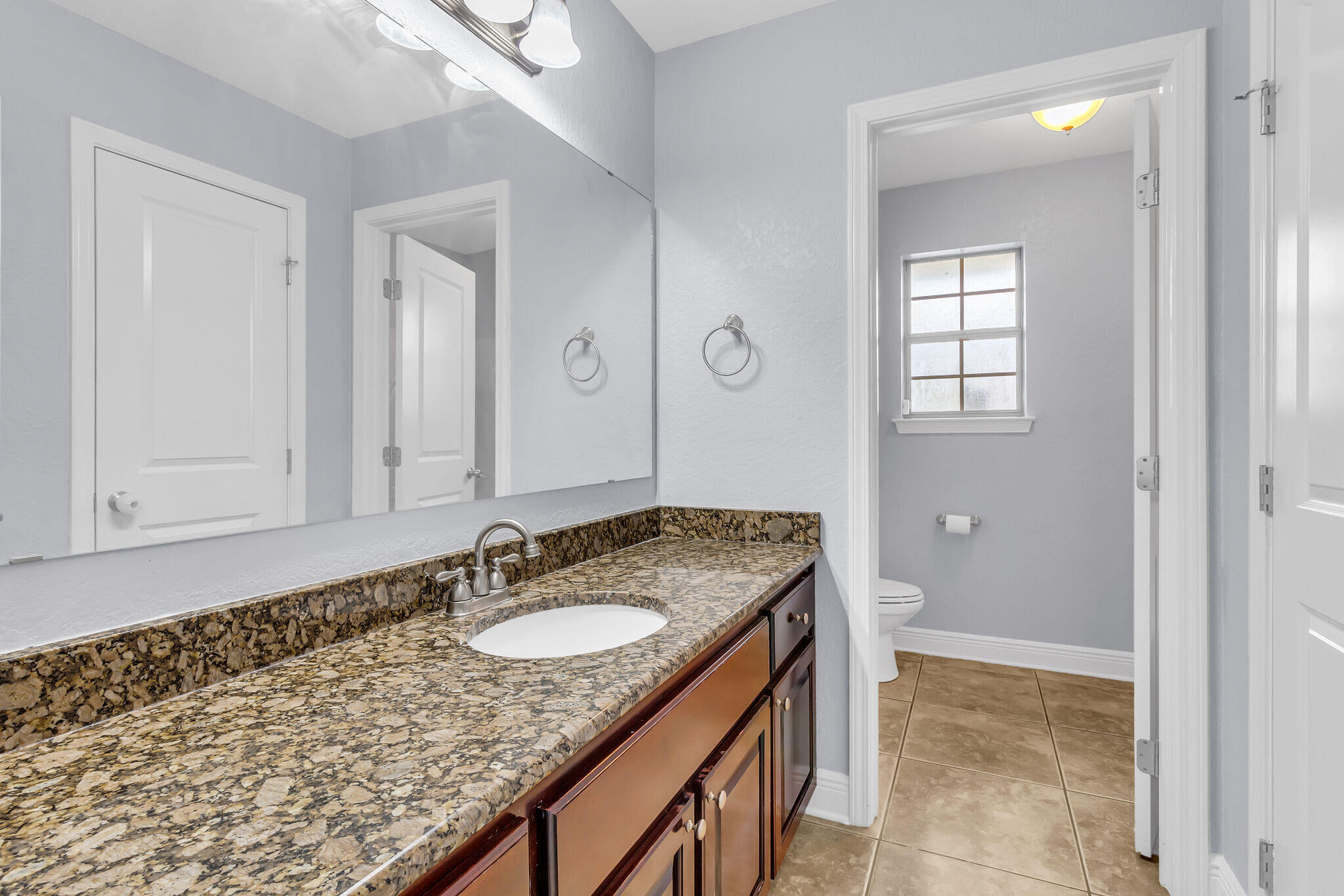 6181 Hummingbird Lane Crestview, FL 32536 - Photo 36 of 46 a bathroom with a sink double vanity and a mirror